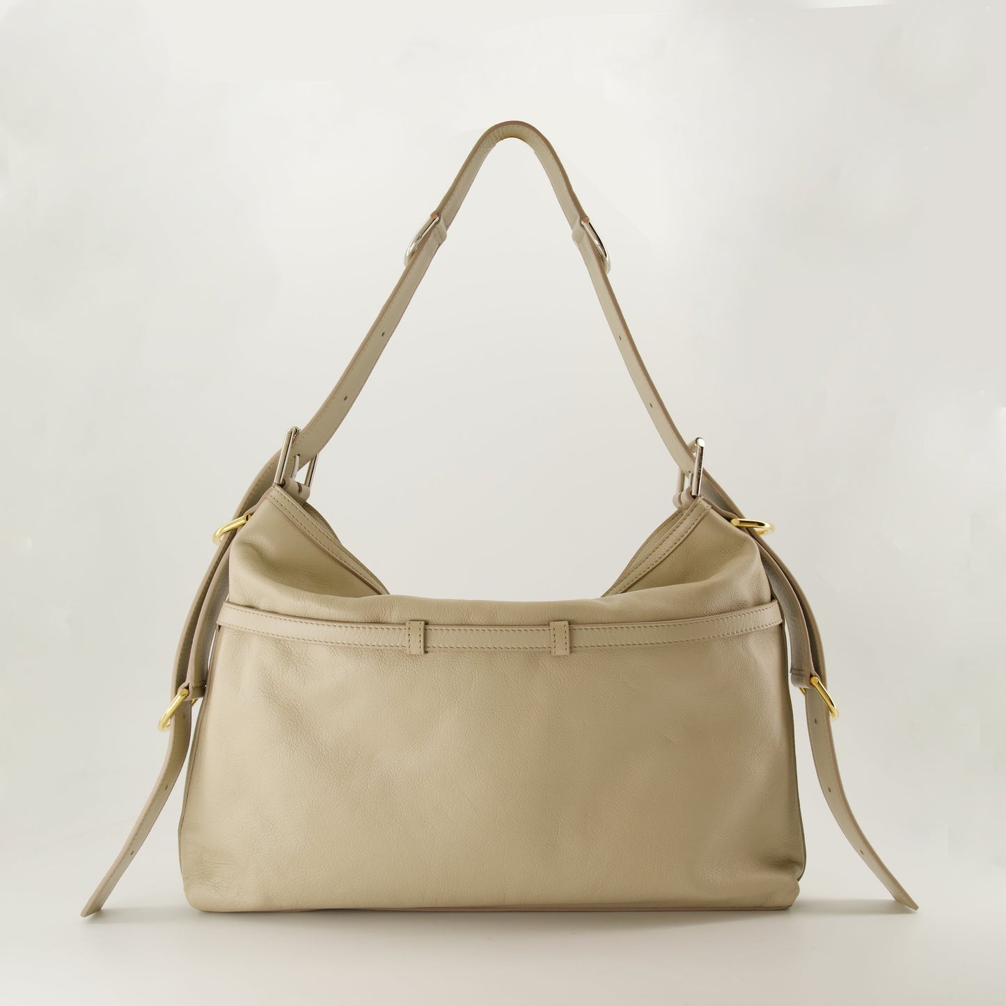 Beige leather bag, adjustable strap bag, designer medium bag, signature metal accents, contemporary fashion bag