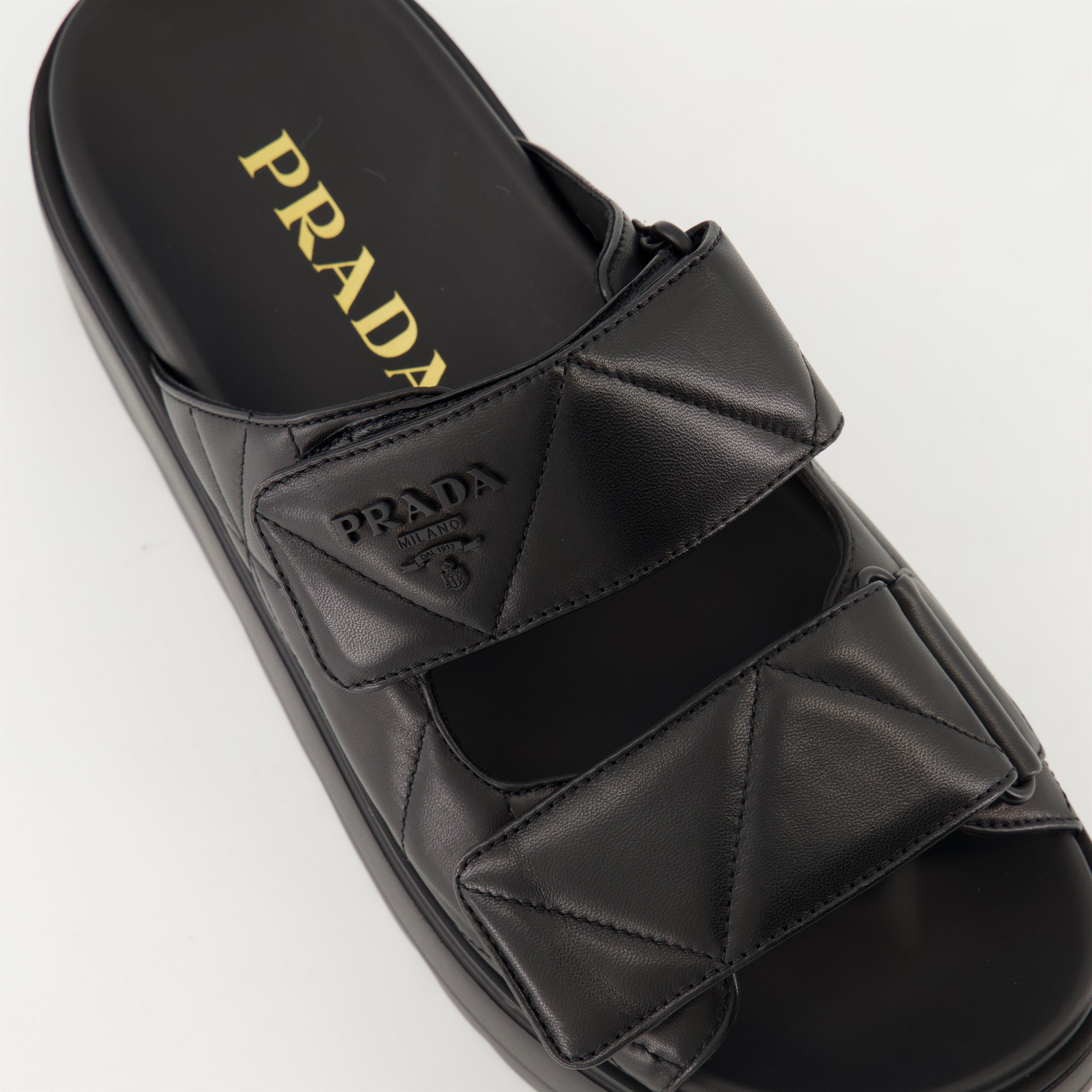 black mules, nappa leather footwear, quilted mules, Prada footwear, women's mules