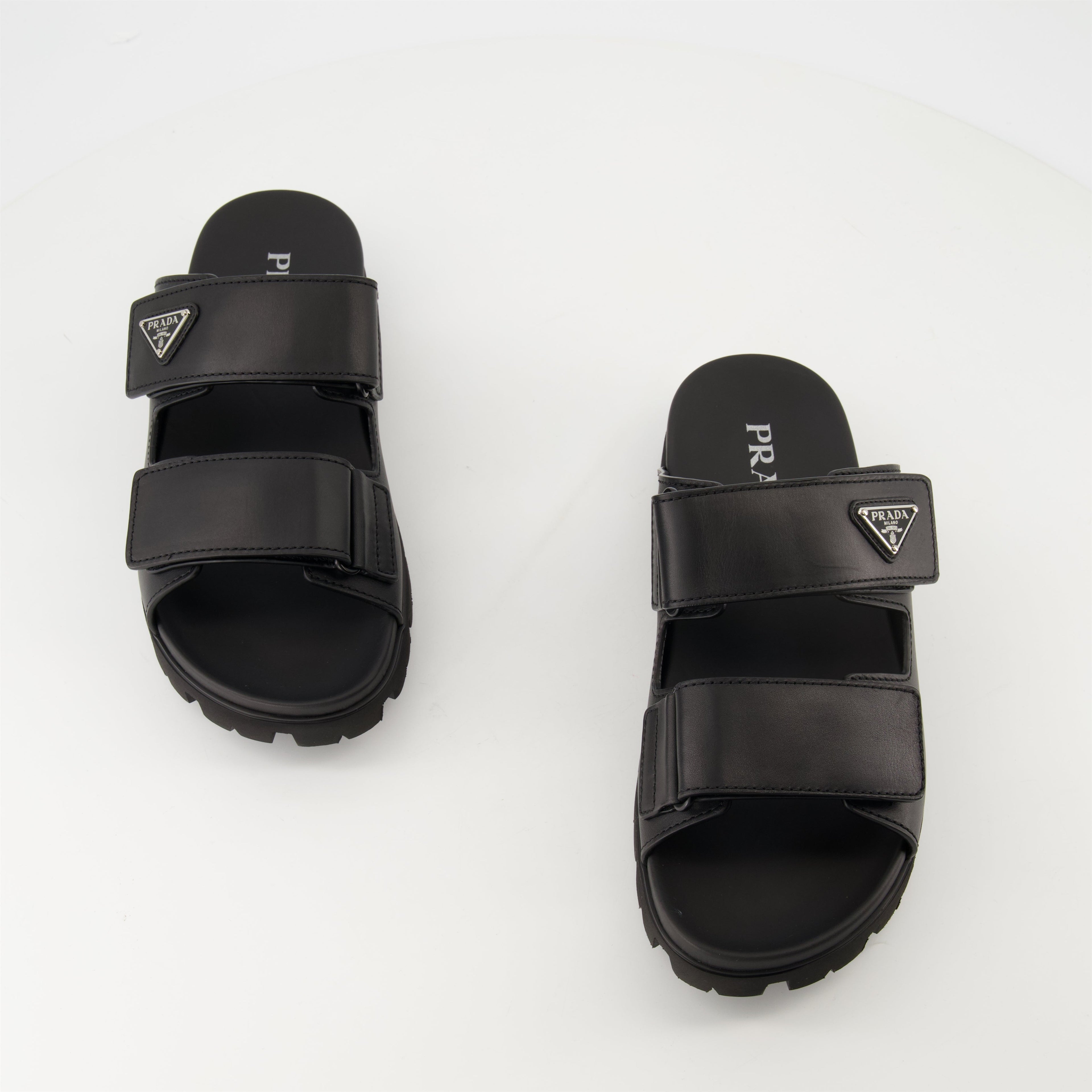 black leather slides, Prada slides, men's leather footwear, stylish casual shoes, comfortable leather sandals