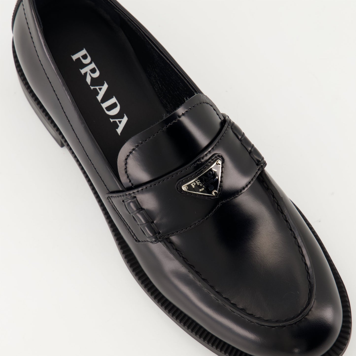 Prada moccasins, black leather moccasins, luxury footwear, designer moccasins, autumn-winter shoes