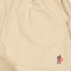 beige nylon shorts, Moncler Grenoble, luxury leisurewear, Spring-Summer 2024, technical crinkled fabric