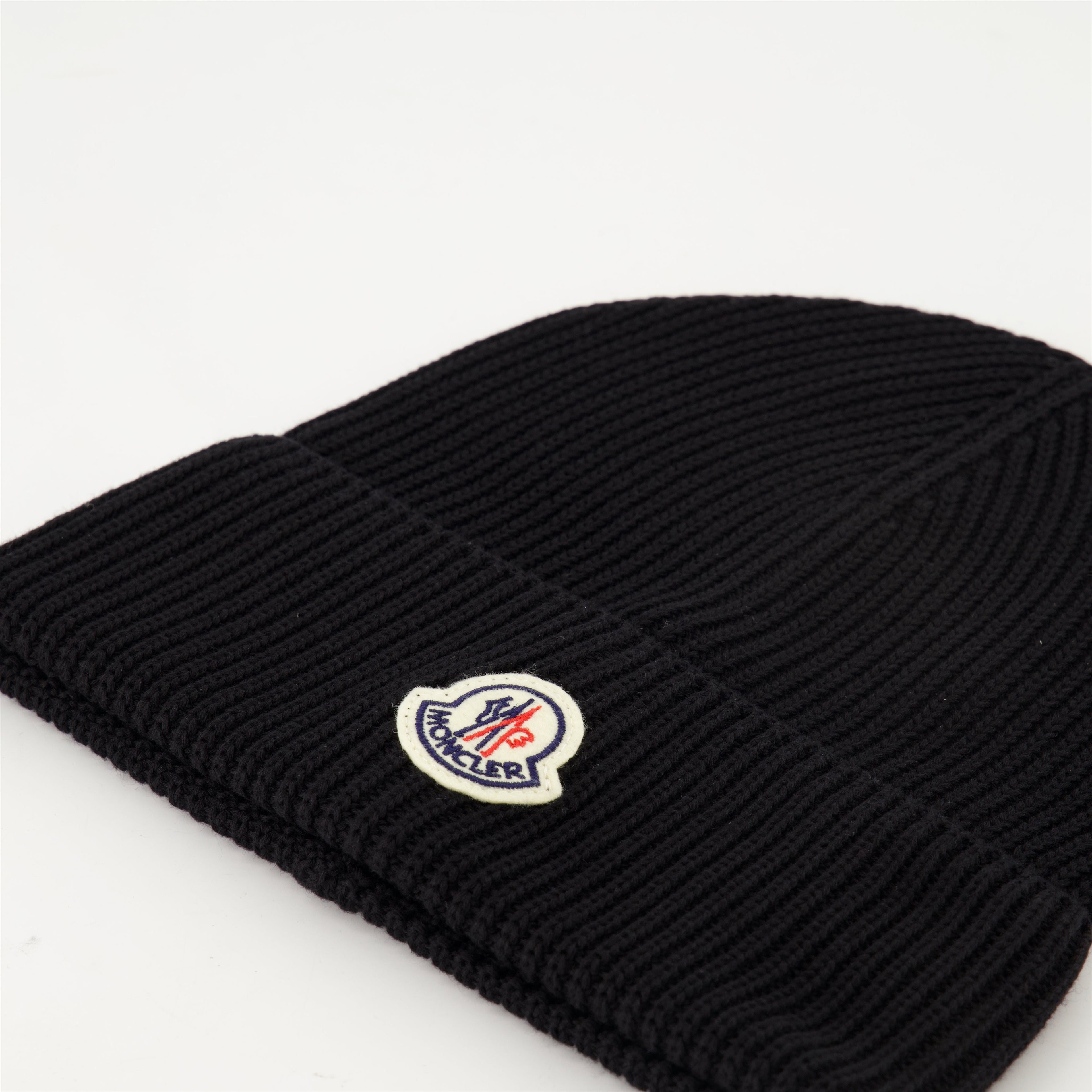 black knit bonnet, Moncler logo, Spring-Summer 2025, ribbed cotton accessory, stylish headwear