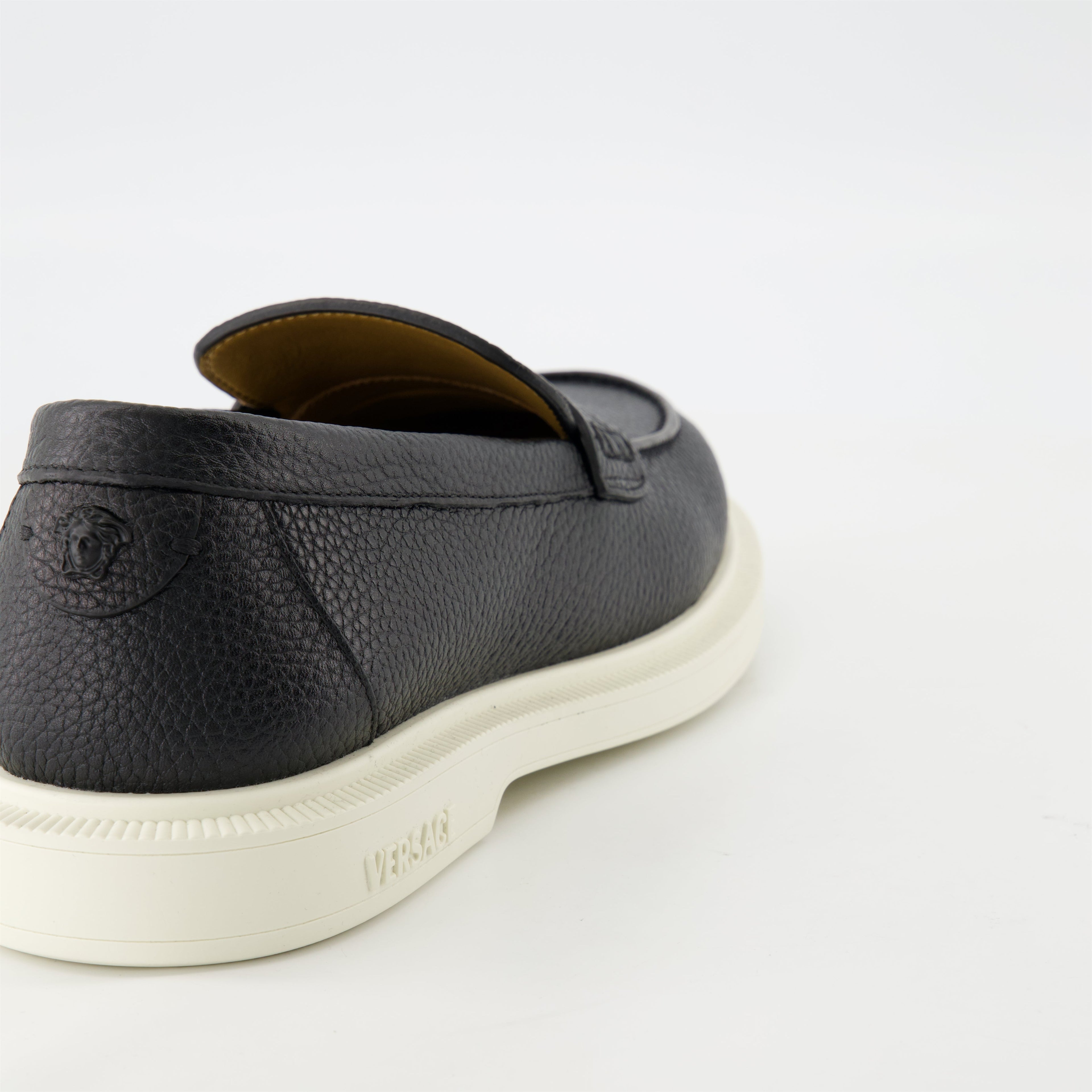 black leather moccasins, grained leather shoes, slip-on footwear, Versace design, Medusa emblem shoes