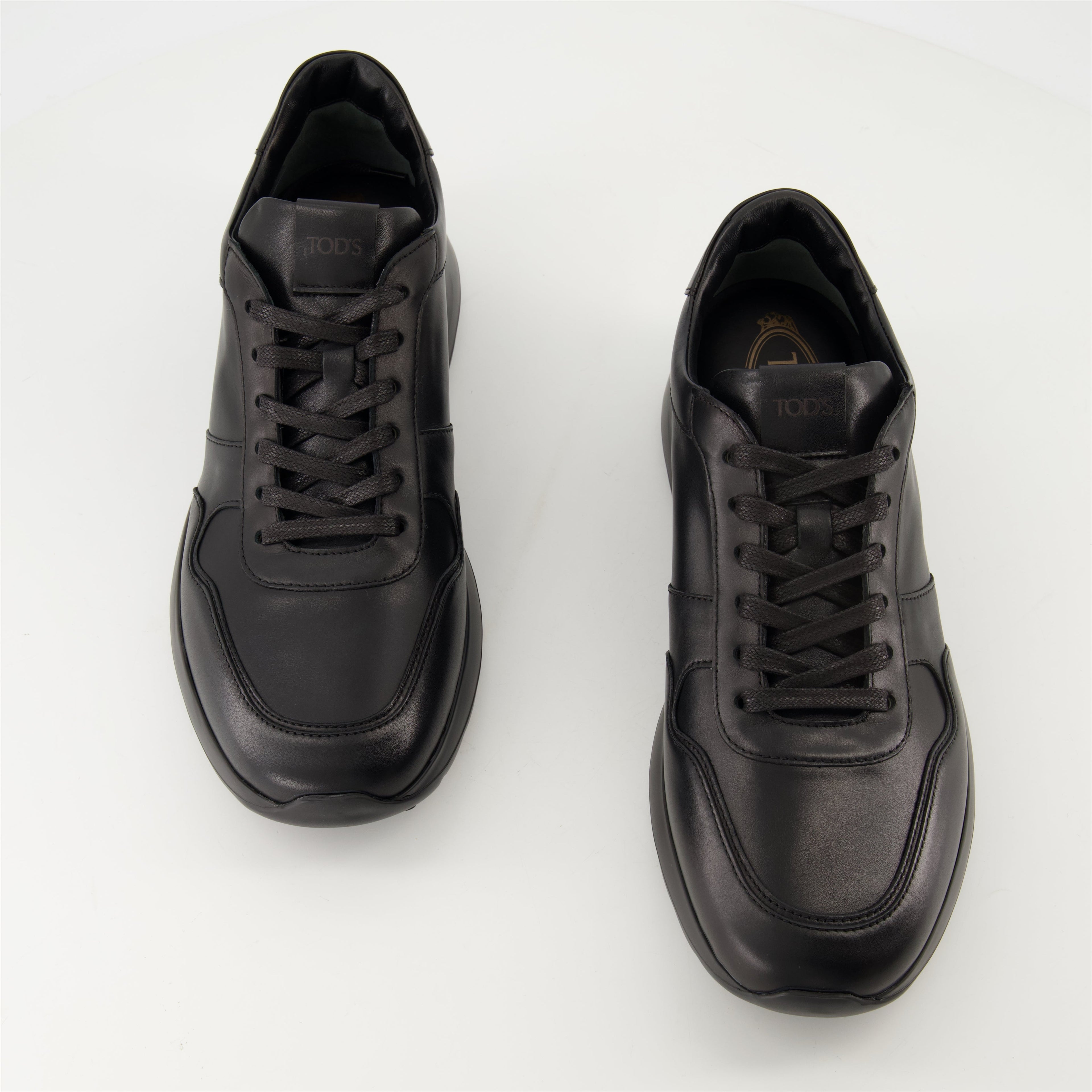black sneakers, Tod's shoes, leather footwear, stylish sneakers, casual elegance