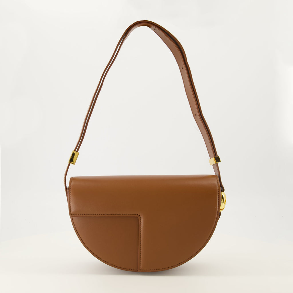 brown handbag, Patou handbag, leather shoulder bag, semi-circular bag, chic bag