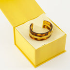 Fendi bracelet, plexiglass jewelry, brown accessory, FF logo design, contemporary fashion