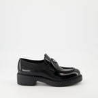 patent leather mocassins, luxury footwear, Prada AW24, black mocassins, elegant shoes
