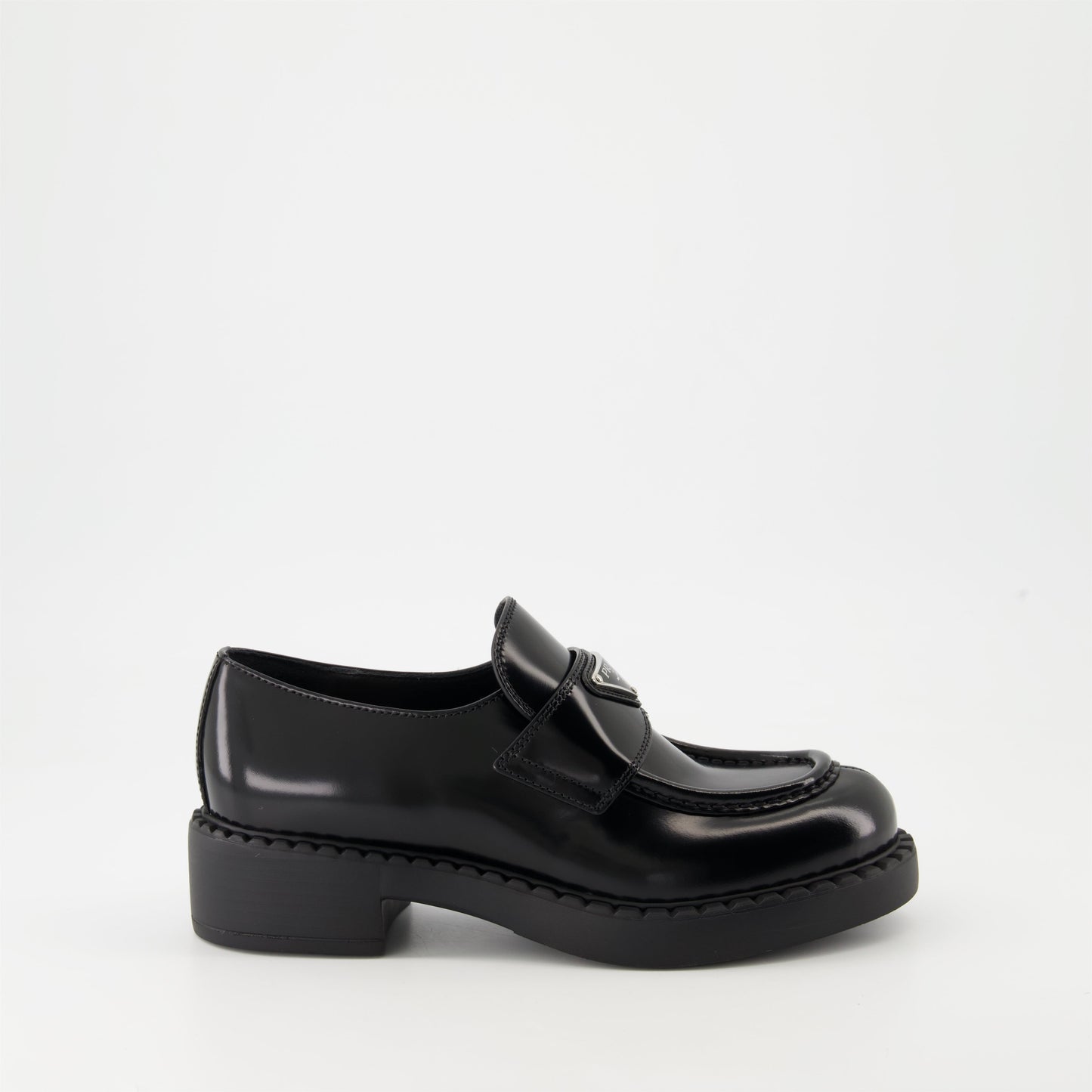 patent leather mocassins, luxury footwear, Prada AW24, black mocassins, elegant shoes