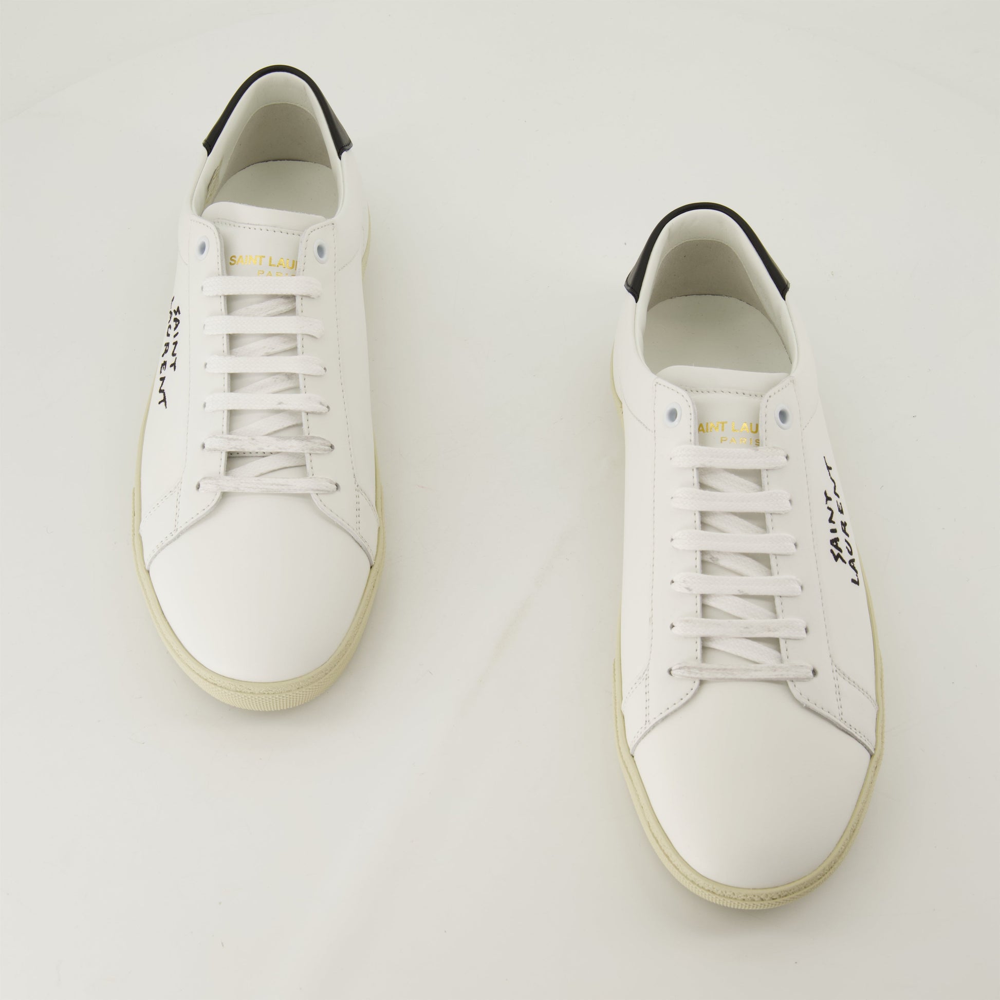 smooth leather sneakers, round toe design, gum sole sneakers, white leather sneakers, logo accent shoes