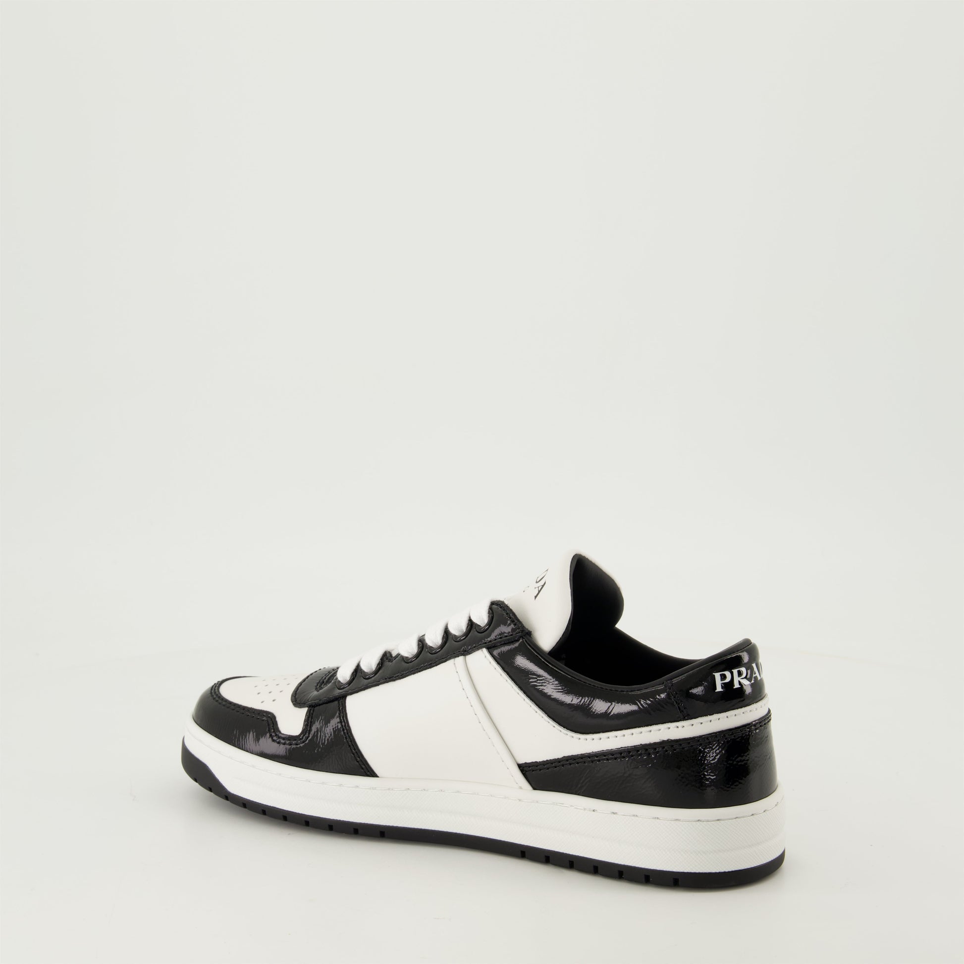 black patent sneakers, geometric tread pattern, lace-up design, removable leather insole, two-tone sneakers