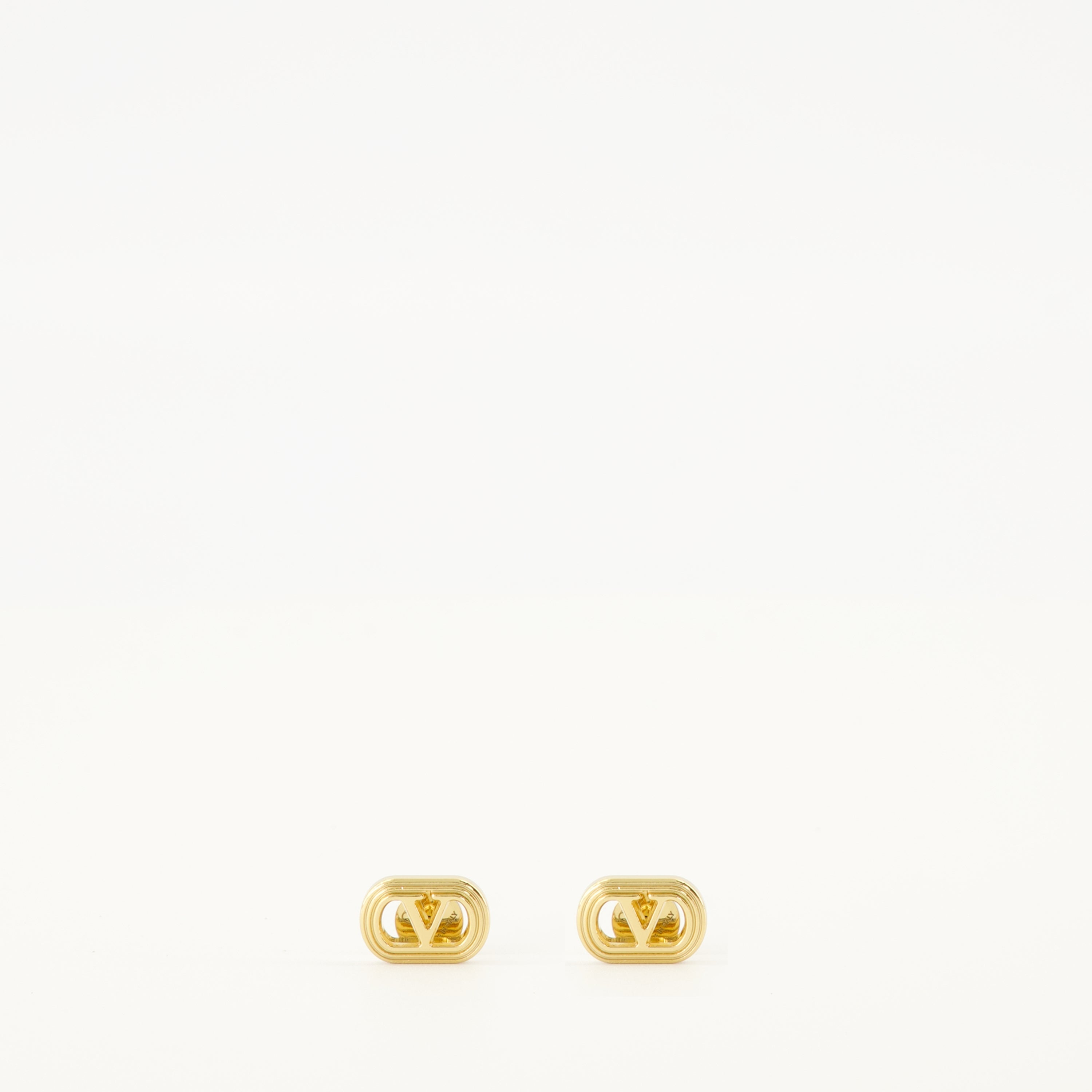 Valentino Garavani earrings, gold earrings, brass jewelry, VLogo accessories, chic earrings