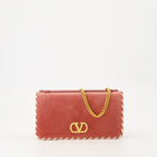 pink velvet clutch, Valentino Garavani, designer handbag, luxury accessories, Chic evening bag