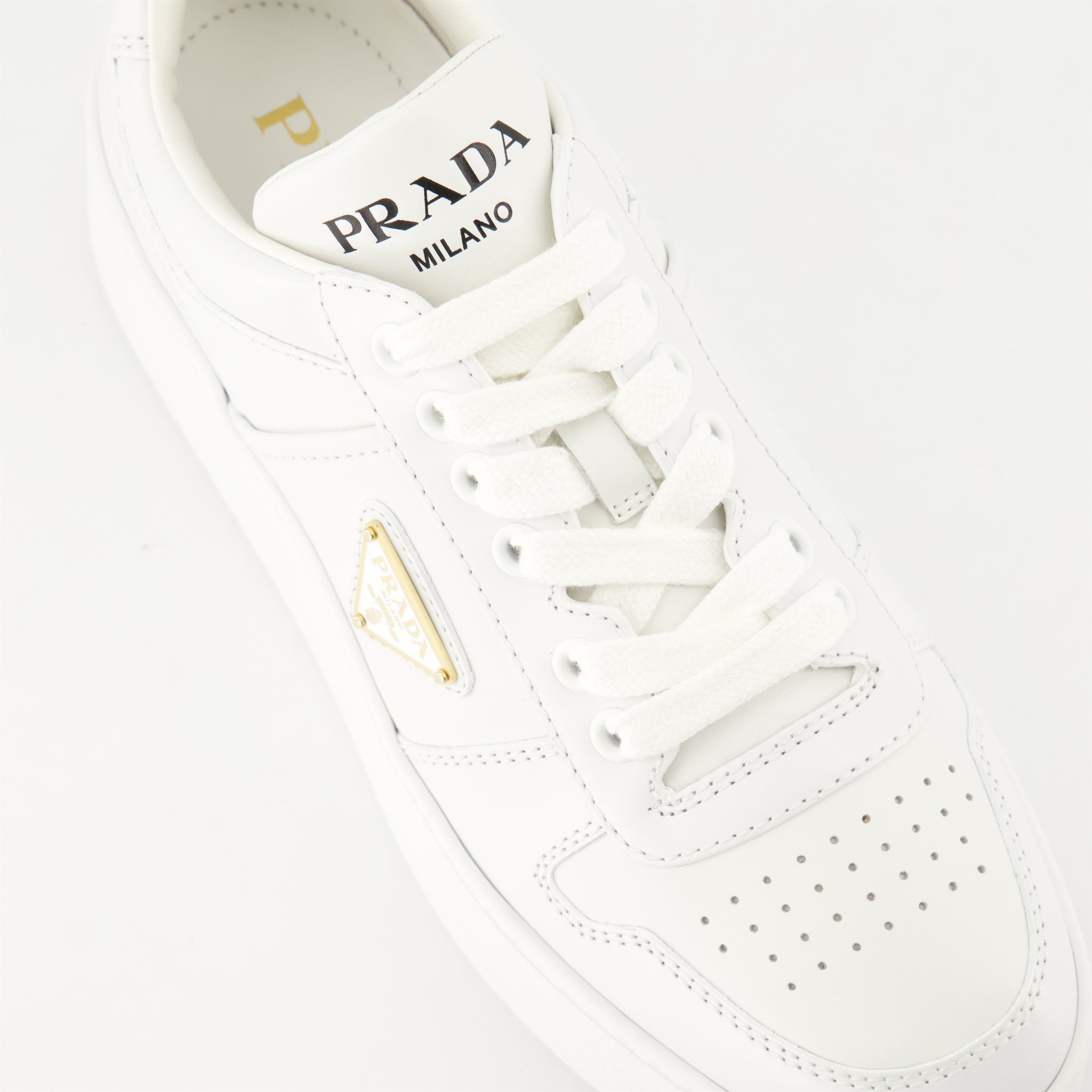 white sneakers, Prada Downtown Bold, platform shoes, smooth leather sneakers, geometric perforations