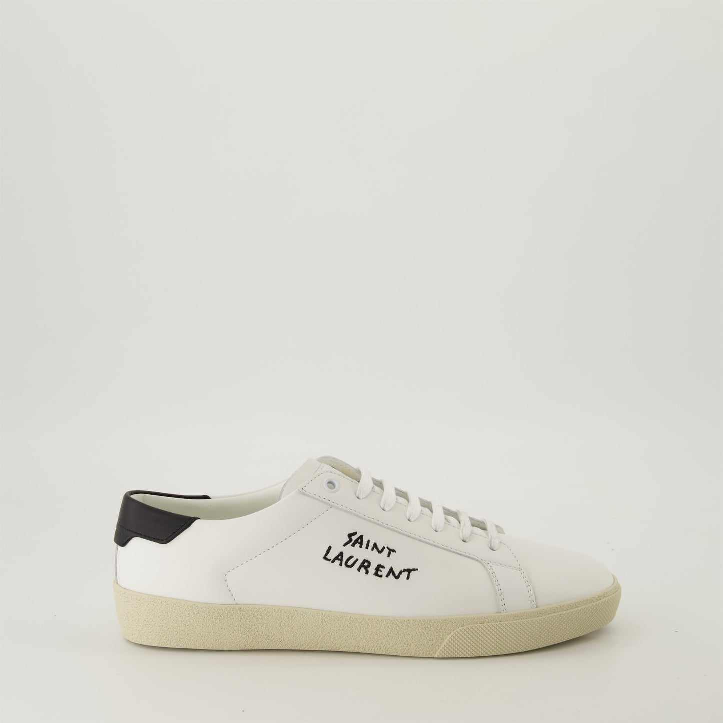 smooth leather sneakers, round toe design, gum sole sneakers, white leather sneakers, logo accent shoes