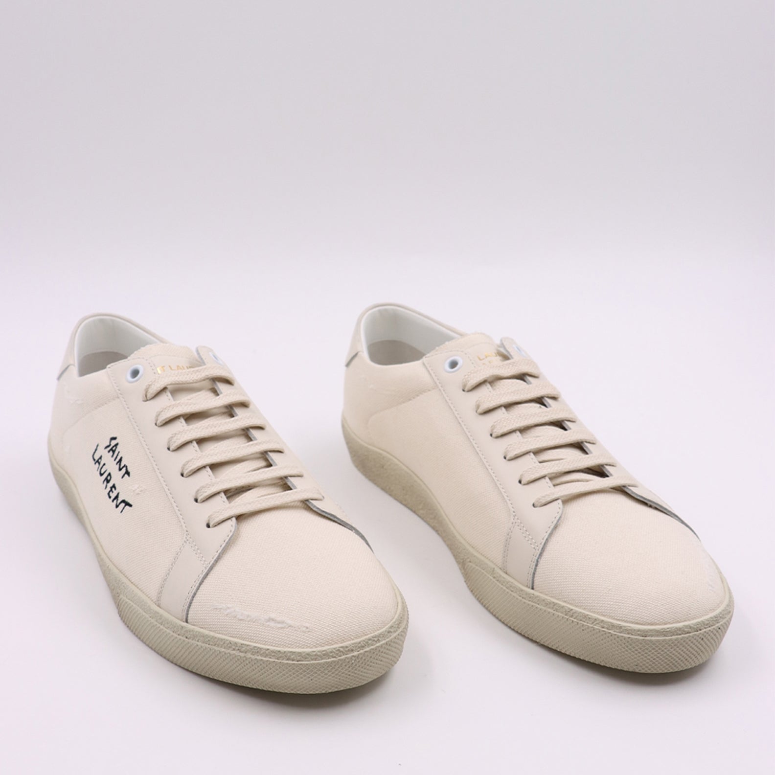 1. Classic sneakers
2. Cotton canvas shoes
3. Saint Laurent footwear
4. Luxury casual sneakers
5. Beige sneakers