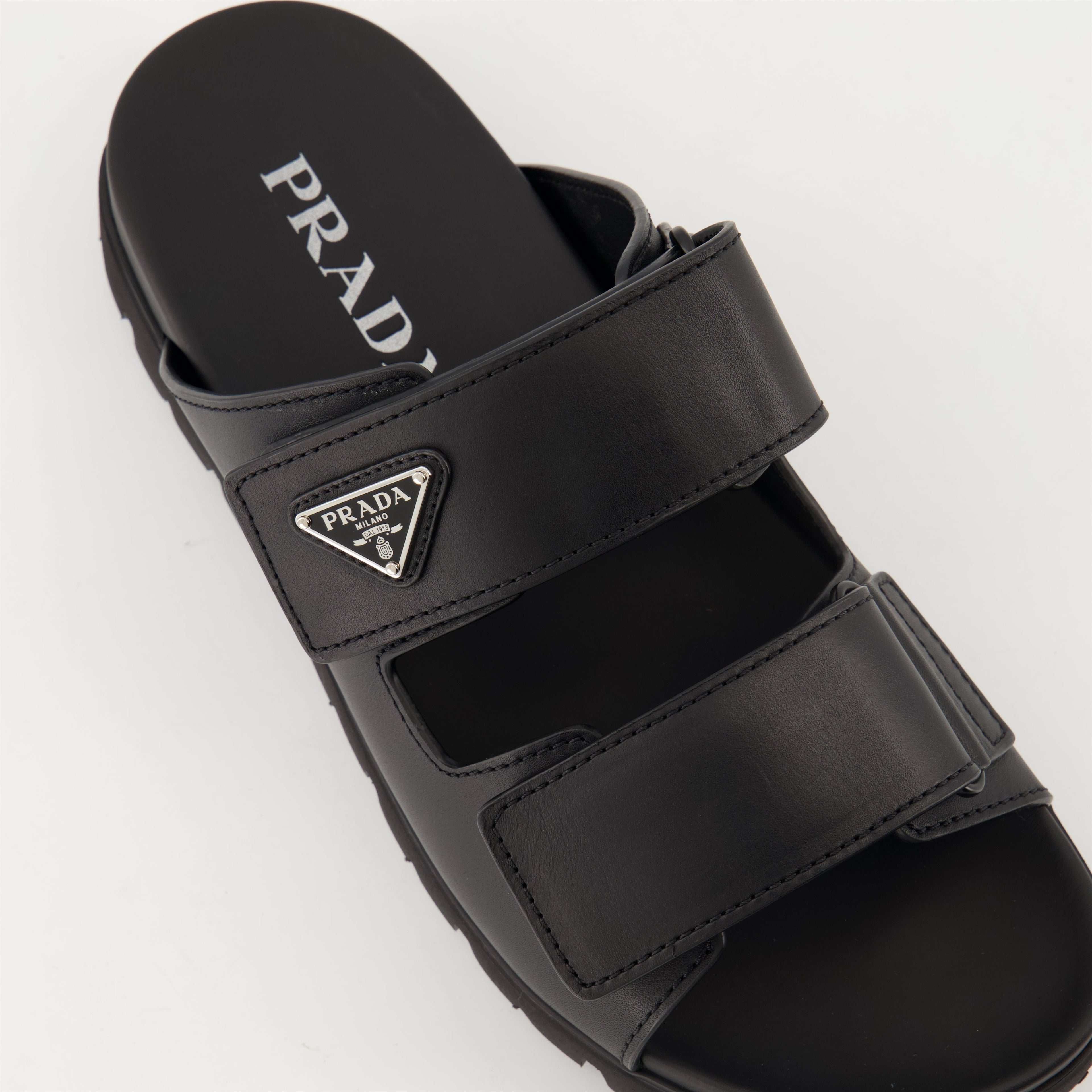 black leather slides, Prada slides, men's leather footwear, stylish casual shoes, comfortable leather sandals