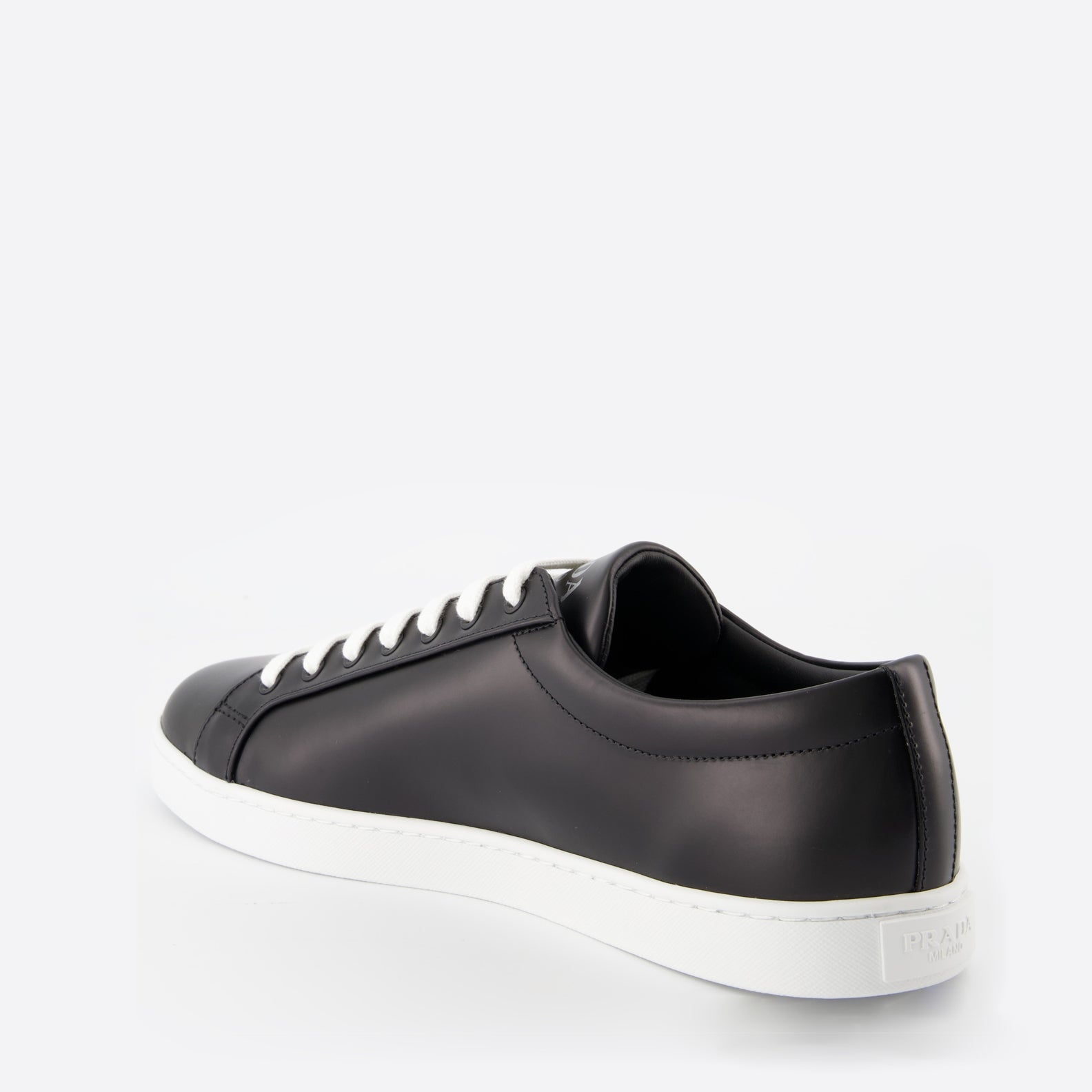 black leather sneakers, elegant footwear, men's sneaker style, contrast sole design, signature logo sneakers