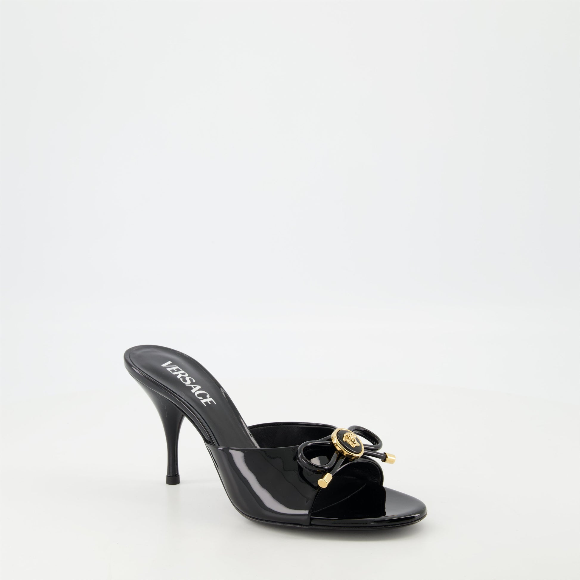 patent leather mules, bow design shoes, Medusa finish footwear, open toe heels, stiletto mules