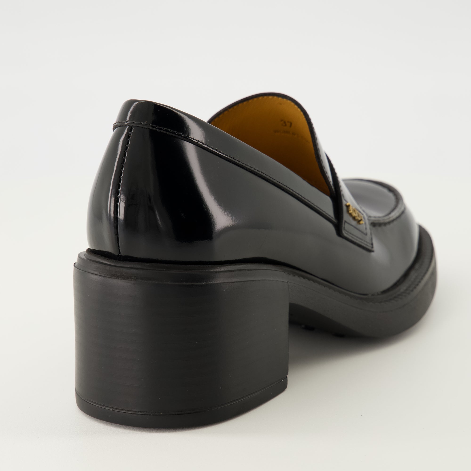black leather moccasins, Tod's footwear, elegant slip-on shoes, autumn winter collection, women's moccasins