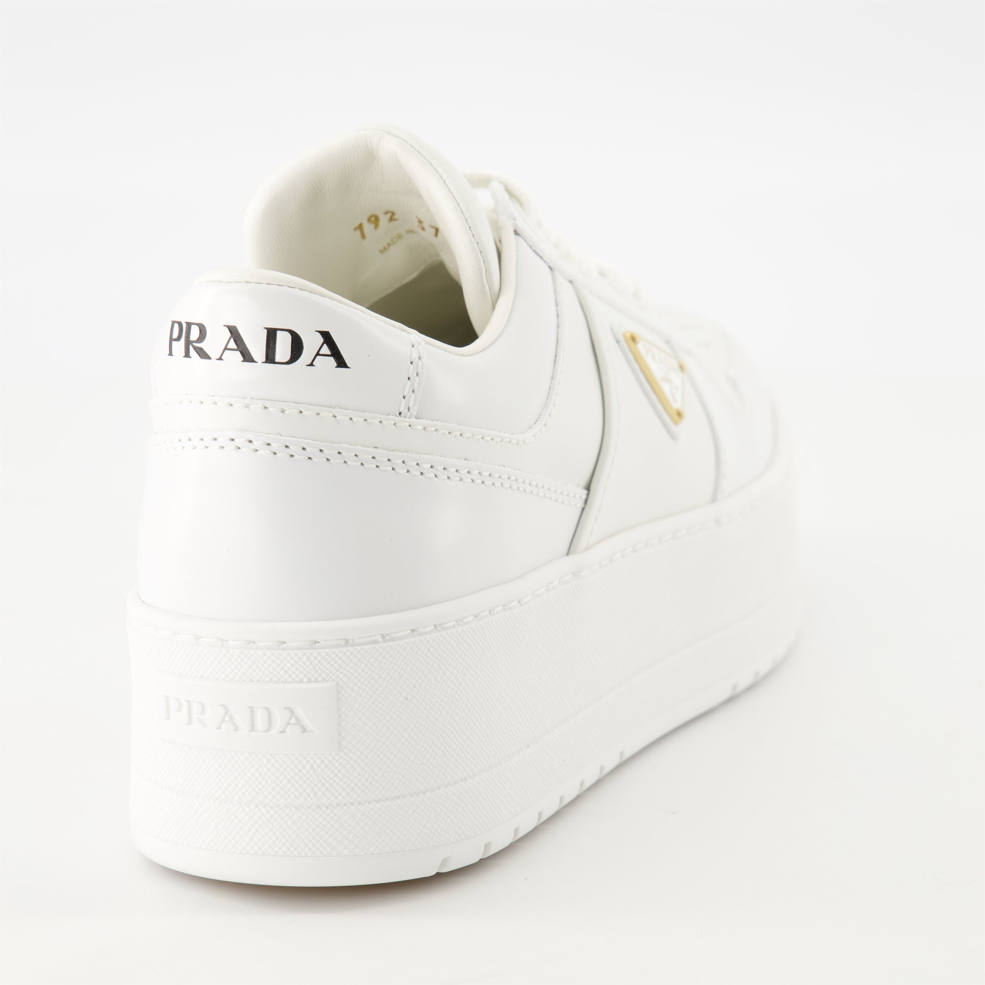 white sneakers, Prada Downtown Bold, platform shoes, smooth leather sneakers, geometric perforations