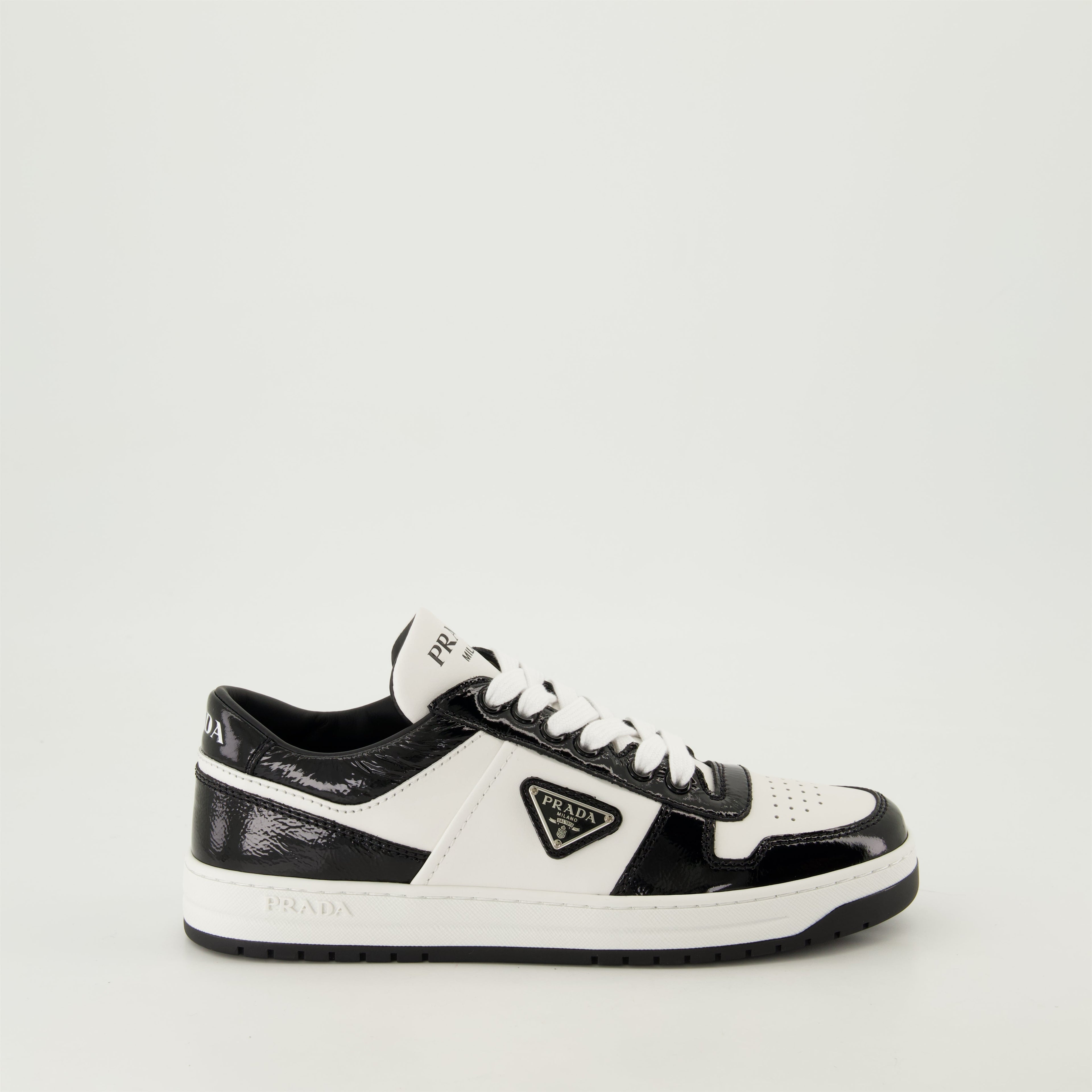 black patent sneakers, geometric tread pattern, lace-up design, removable leather insole, two-tone sneakers