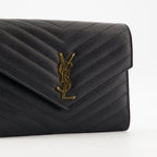 Cassandre pouch, Saint Laurent accessory, black leather pouch, designer handbag, stylish wristlet