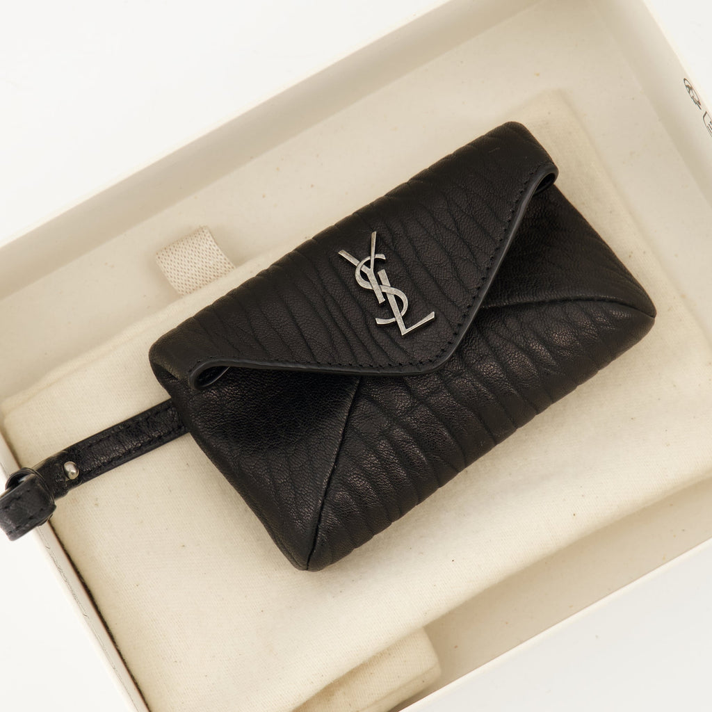 Cassandre envelope, Saint Laurent accessory, black leather bag, luxury clutch, grained leather