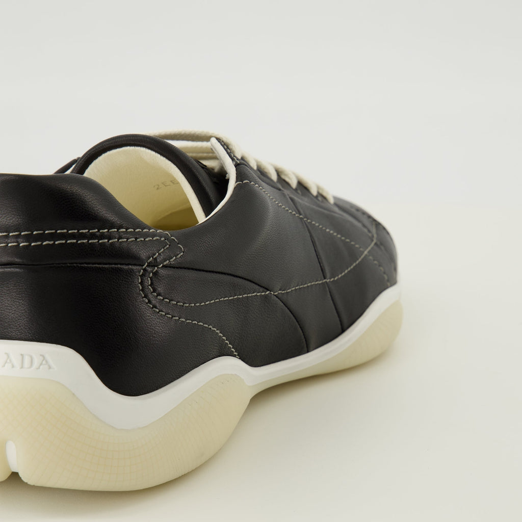 Prada sneakers, black leather footwear, comfort sneakers, rubber sole shoes, stylish lace-up shoes