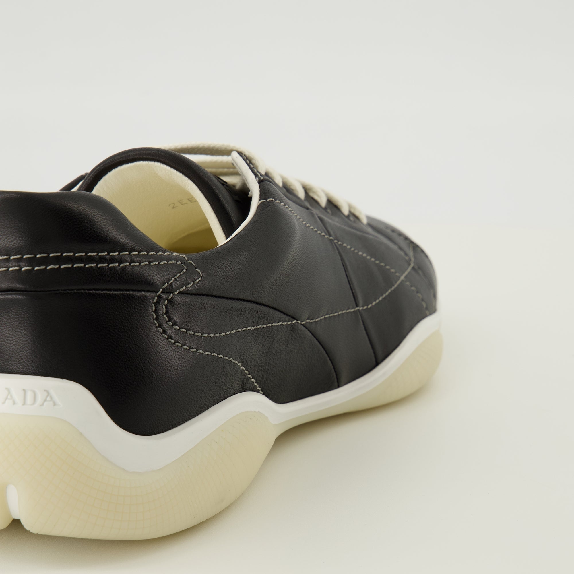Prada sneakers, black leather footwear, comfort sneakers, rubber sole shoes, stylish lace-up shoes