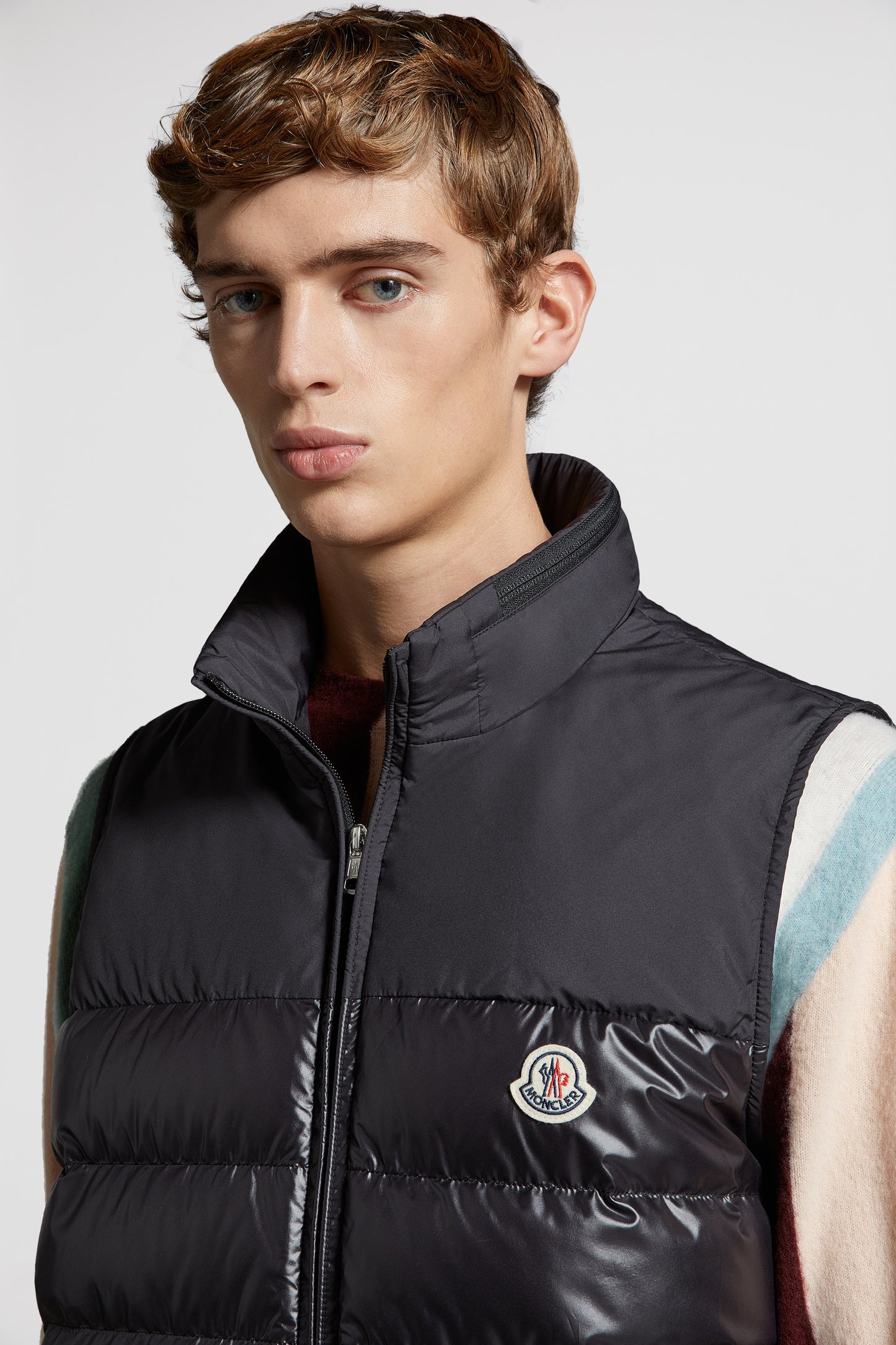 black sleeveless down jacket, luxury menswear, Moncler down jacket, high-end fashion, designer outerwear