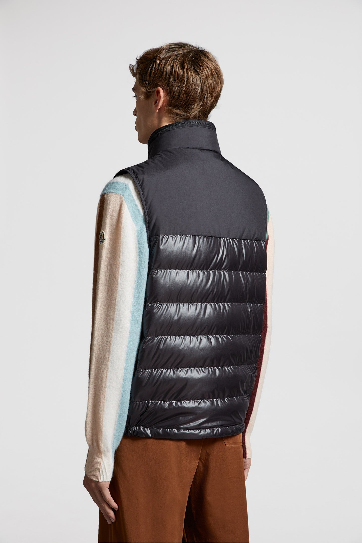 black sleeveless down jacket, luxury menswear, Moncler down jacket, high-end fashion, designer outerwear