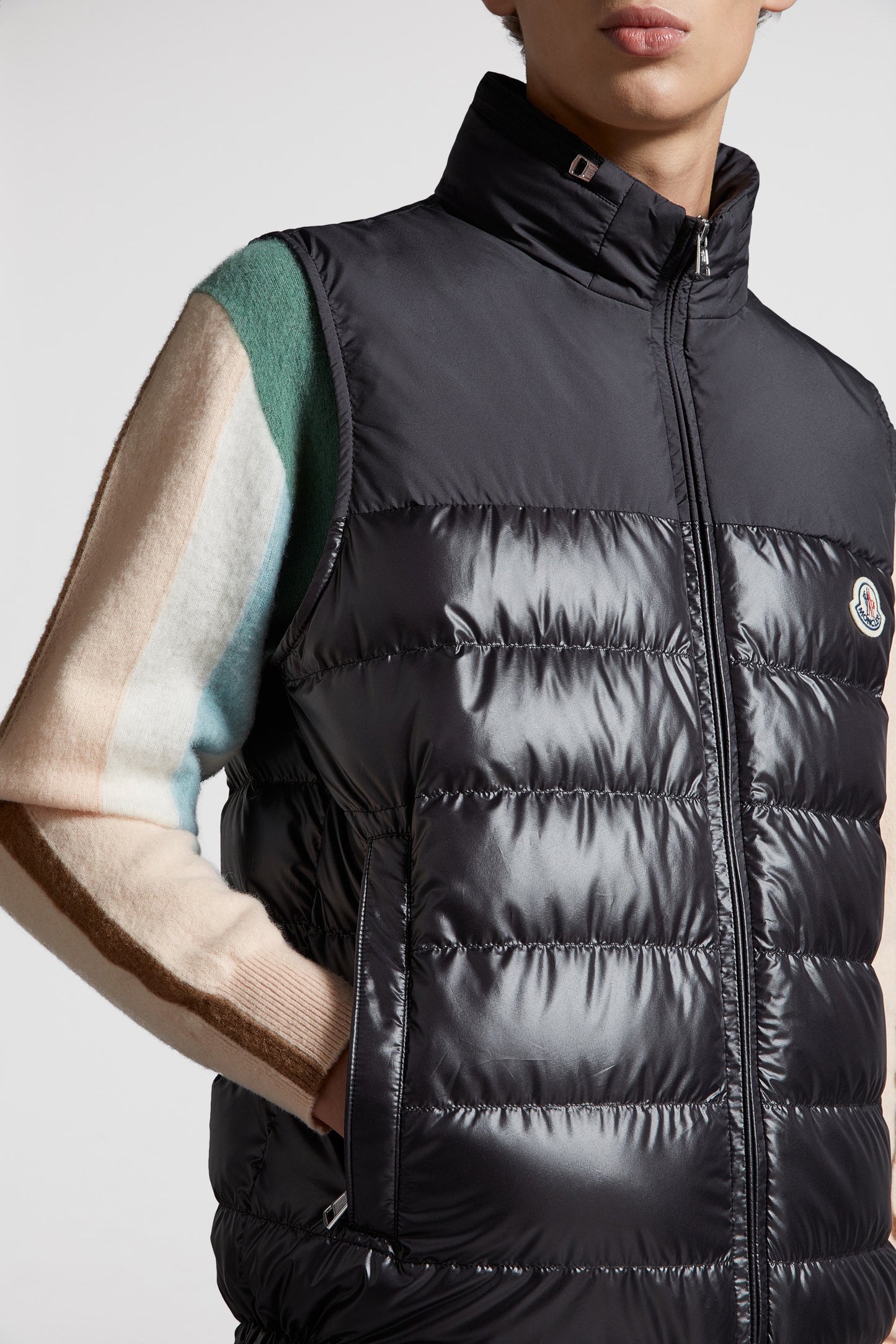 black sleeveless down jacket, luxury menswear, Moncler down jacket, high-end fashion, designer outerwear