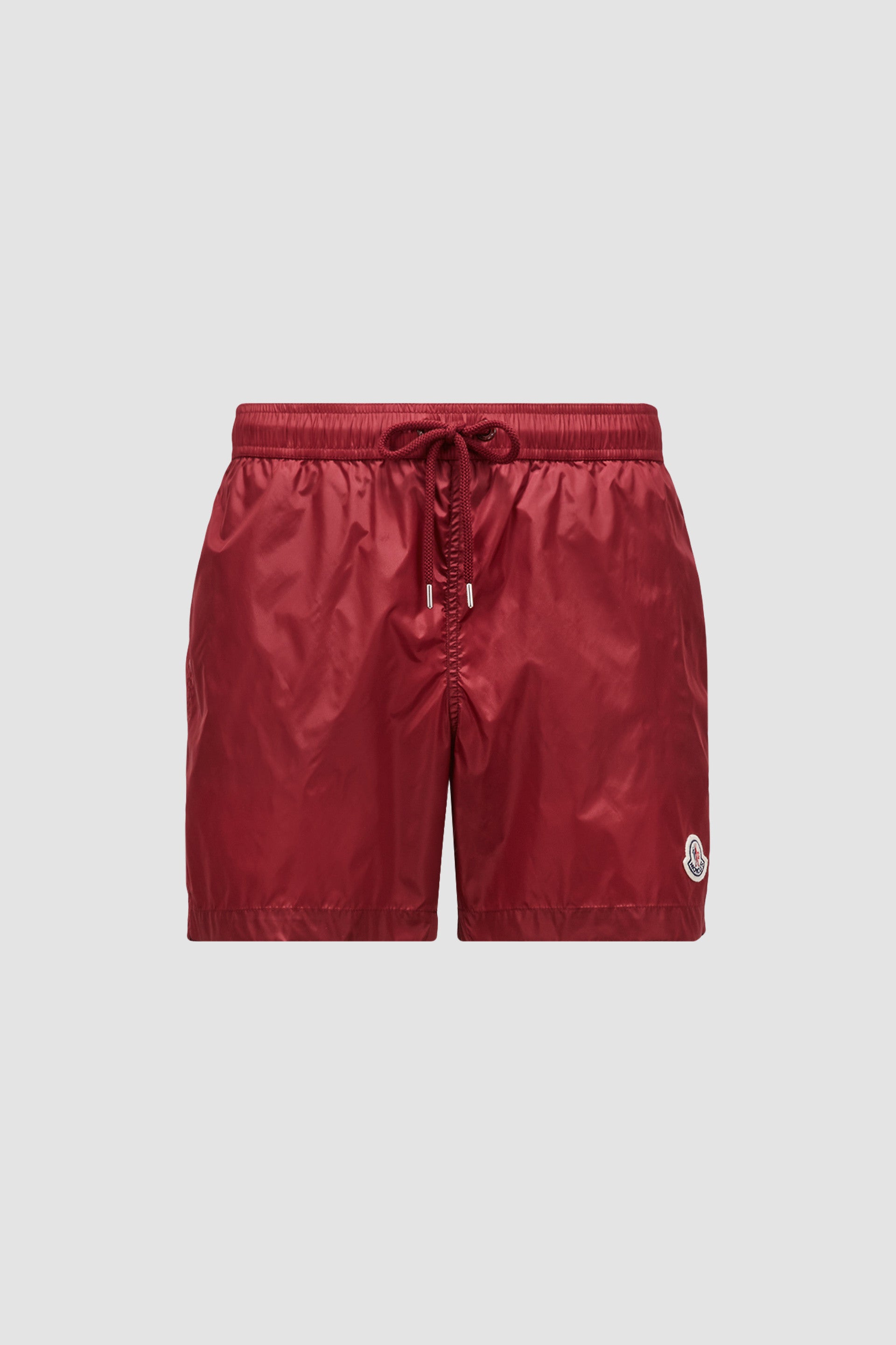 moncler swim shorts, burgundy logo shorts, luxury swimwear, premium swim shorts, high-end beachwear