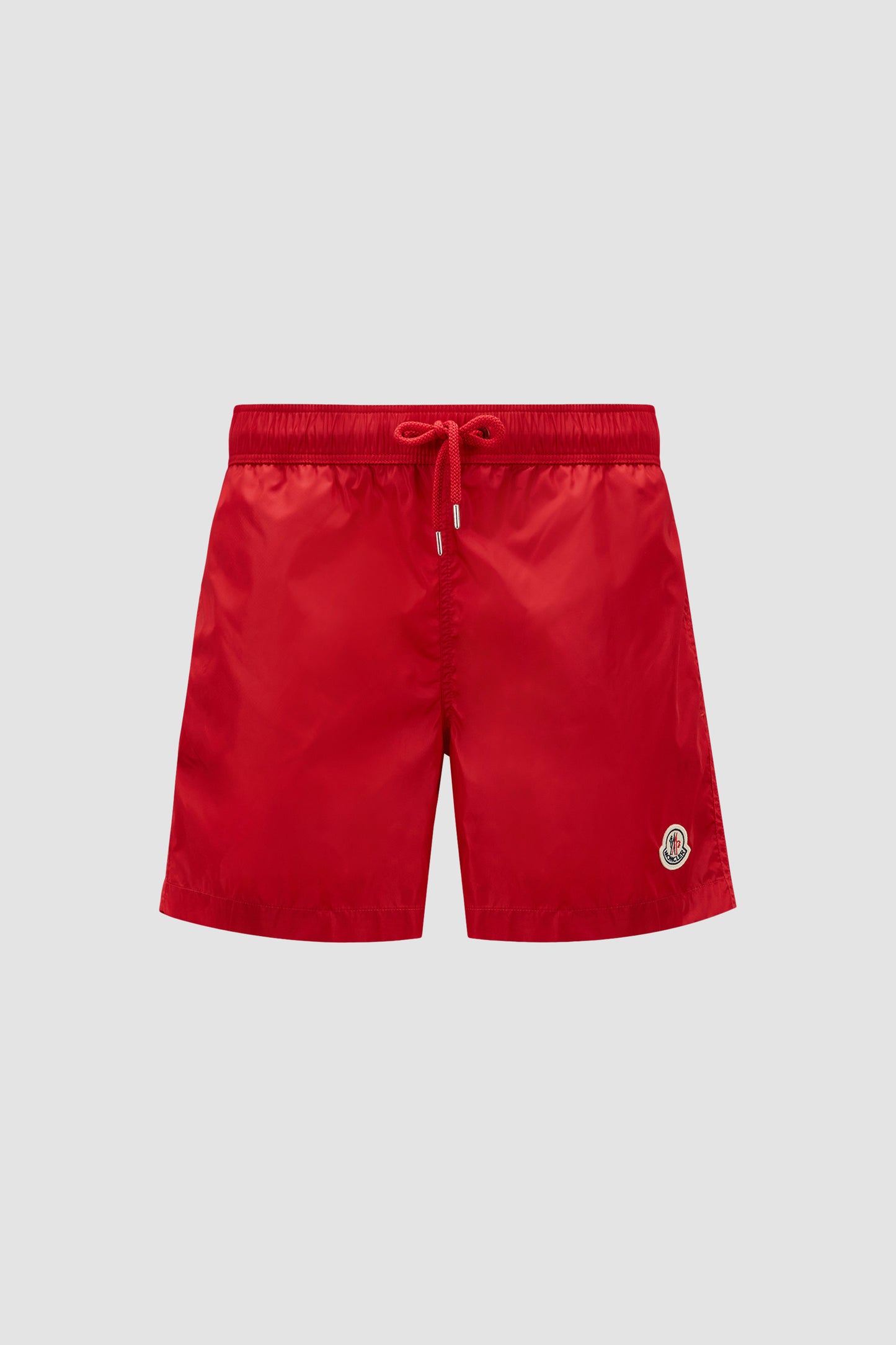 red logo swim shorts, Moncler swimwear, luxury swim shorts, designer swimwear, summer essentials