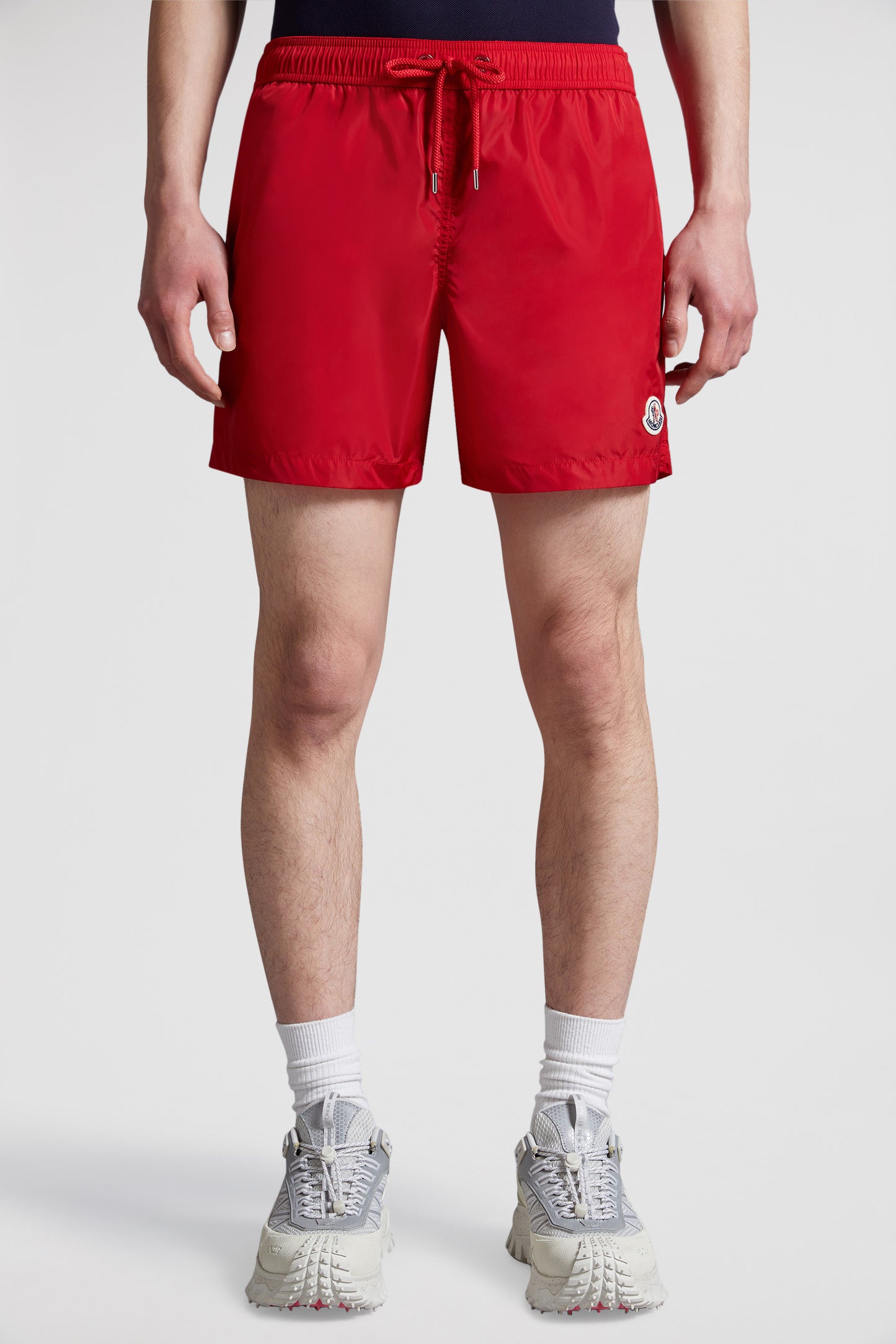 red logo swim shorts, Moncler swimwear, luxury swim shorts, designer swimwear, summer essentials