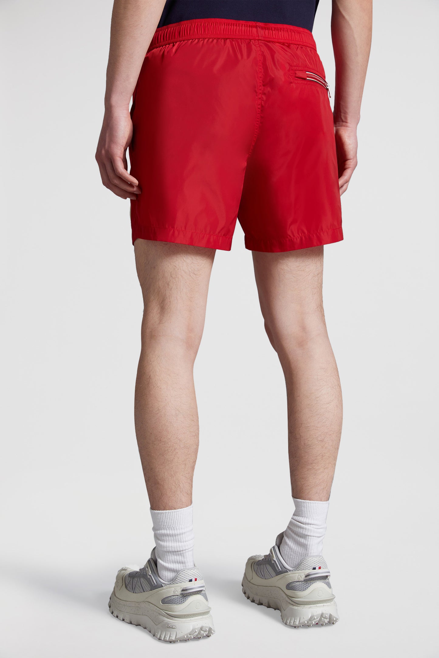 red logo swim shorts, Moncler swimwear, luxury swim shorts, designer swimwear, summer essentials