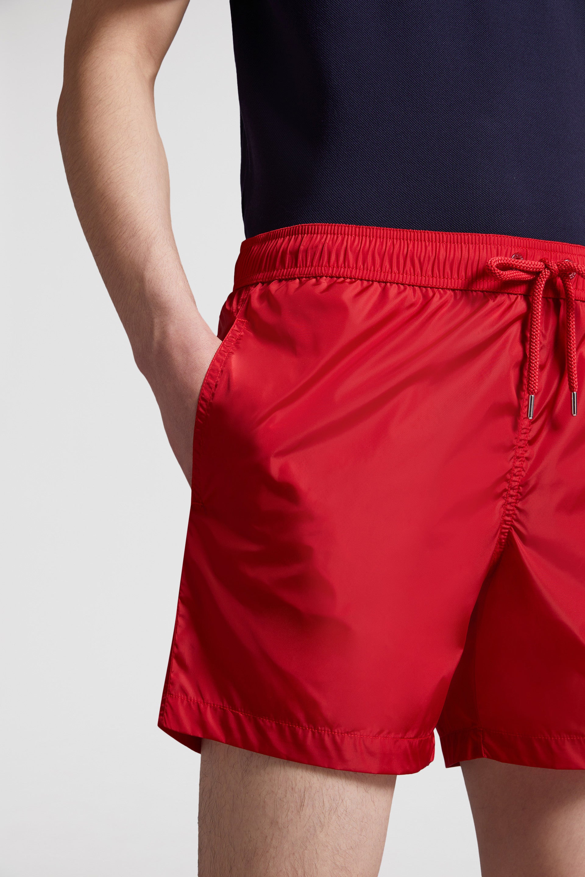 red logo swim shorts, Moncler swimwear, luxury swim shorts, designer swimwear, summer essentials