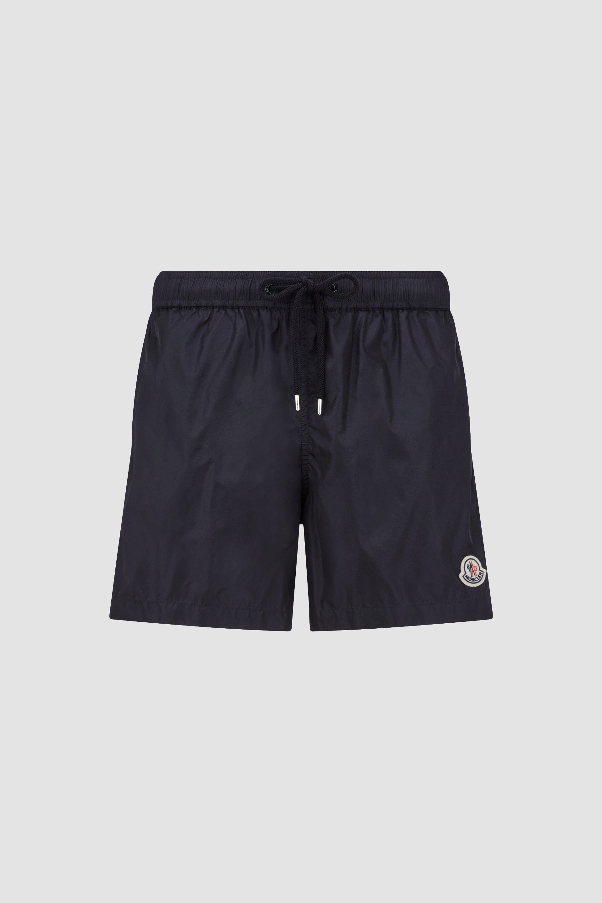 Moncler swim shorts, blue swim shorts, luxury beachwear, high-end swimwear, designer swim shorts