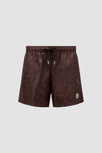Moncler swim shorts, luxury swimwear, monogrammed shorts, designer beachwear, elegant swimwear