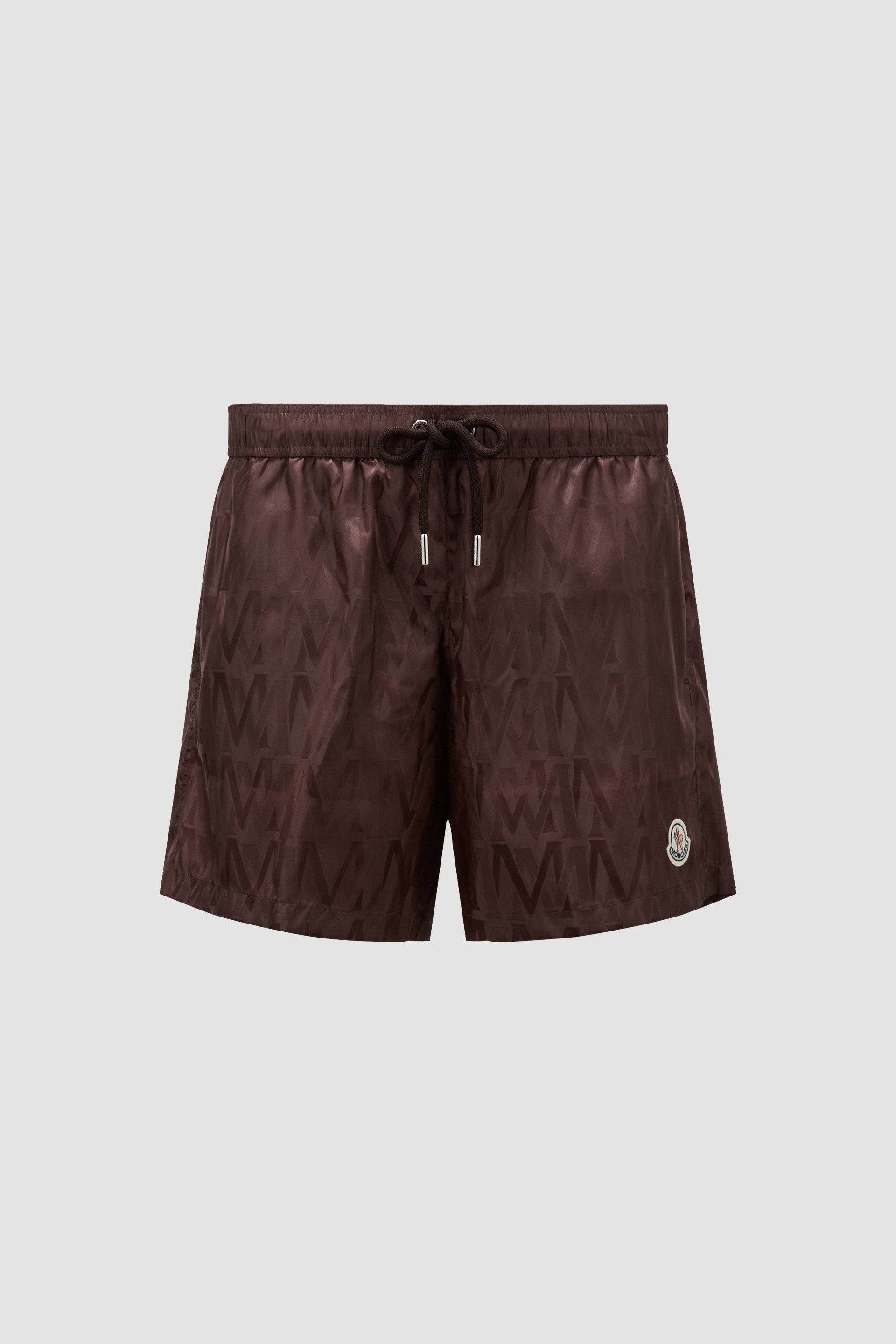 Moncler swim shorts, luxury swimwear, monogrammed shorts, designer beachwear, elegant swimwear