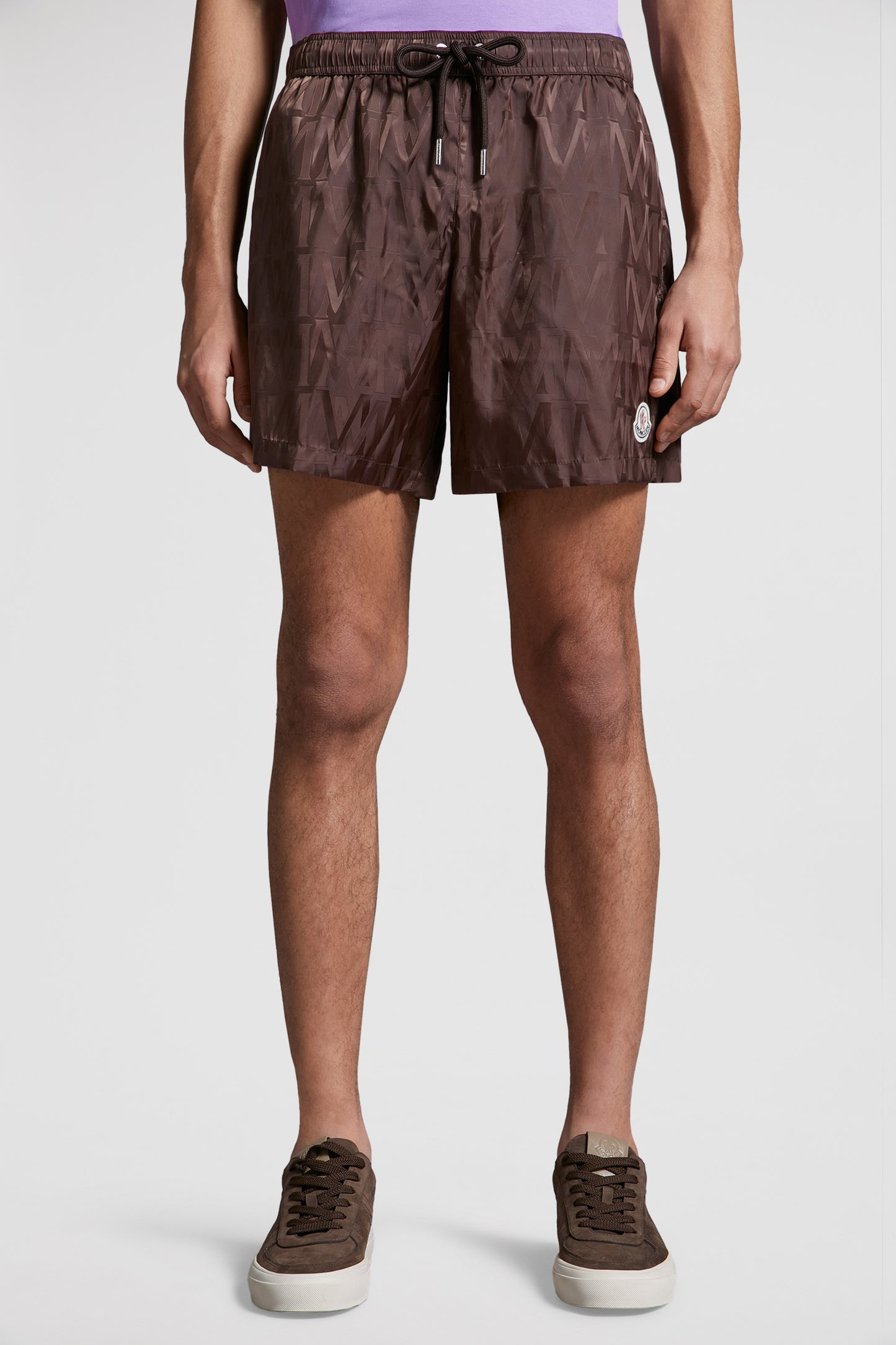 Moncler swim shorts, luxury swimwear, monogrammed shorts, designer beachwear, elegant swimwear