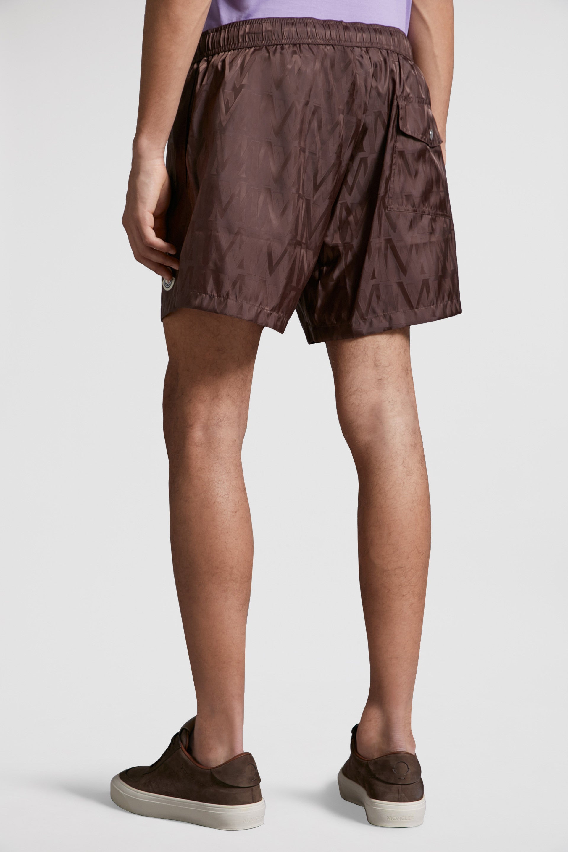 Moncler swim shorts, luxury swimwear, monogrammed shorts, designer beachwear, elegant swimwear