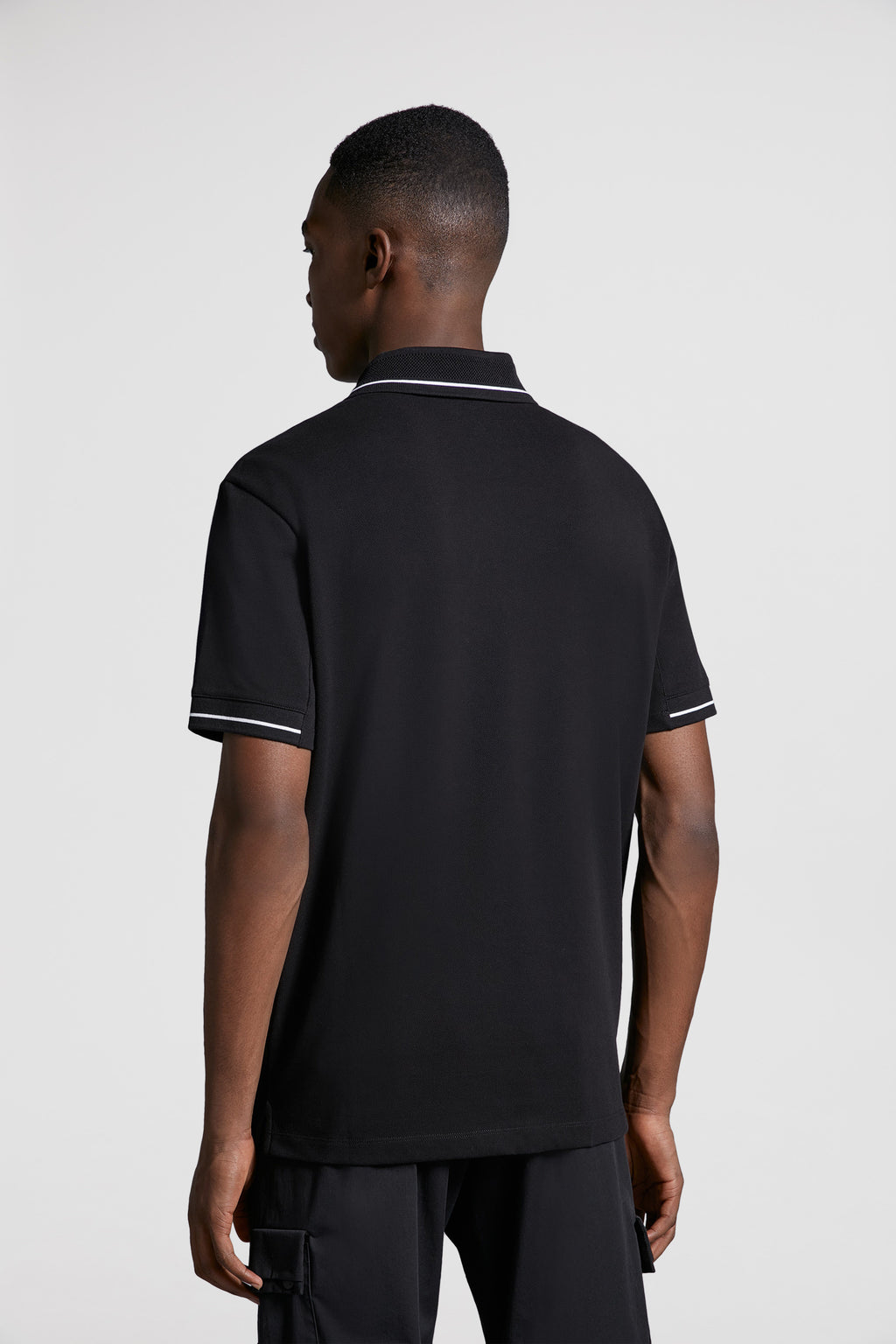 Moncler, black polo, luxury polo, logo trim, designer menswear
