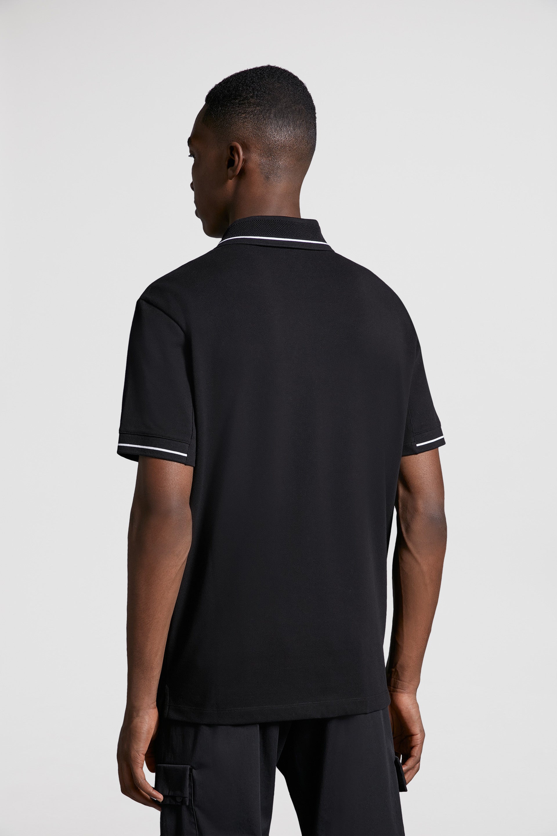 Moncler, black polo, luxury polo, logo trim, designer menswear