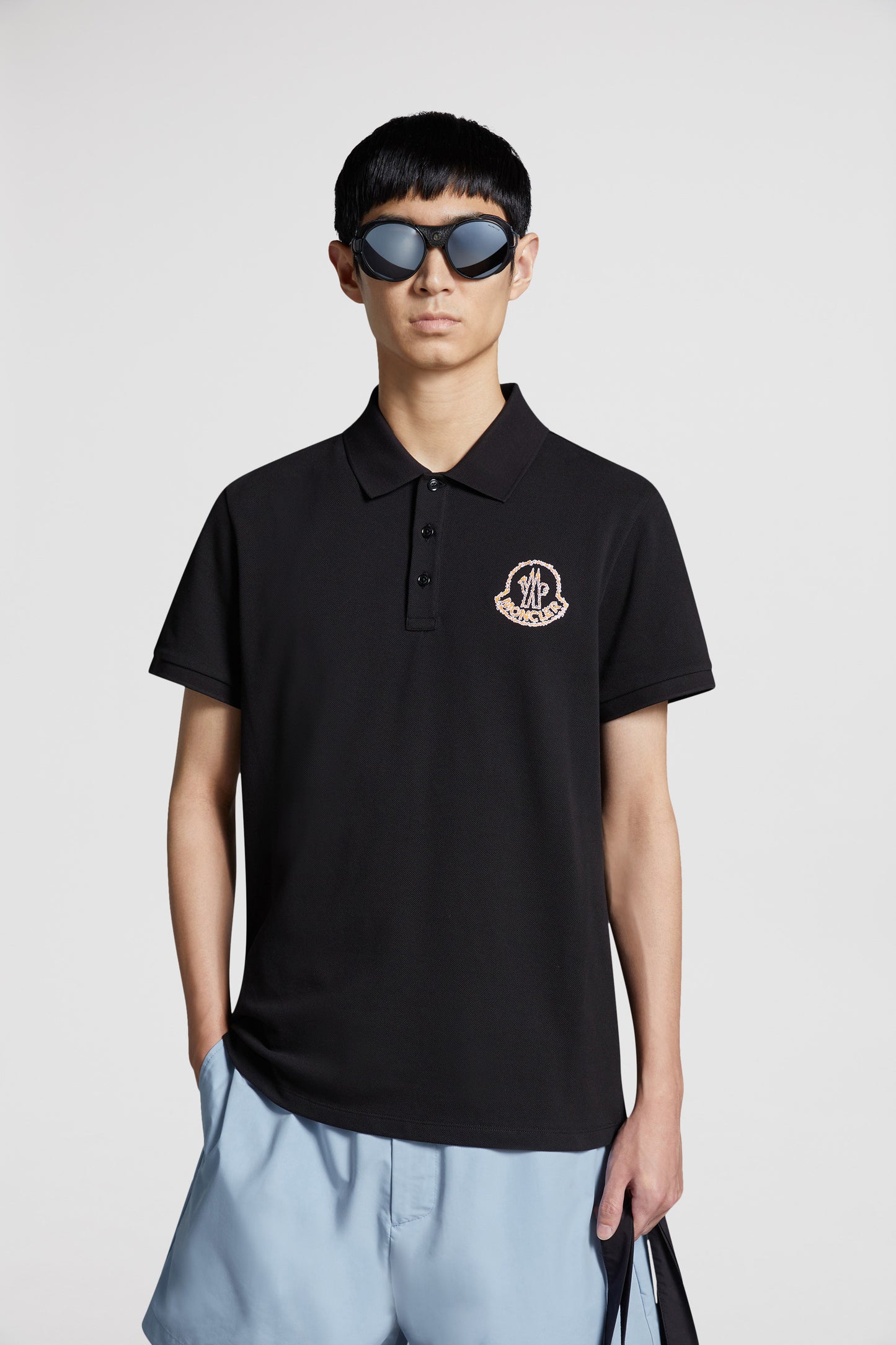 Moncler polo, black logo polo, luxury menswear, designer polo shirts, high-end fashion