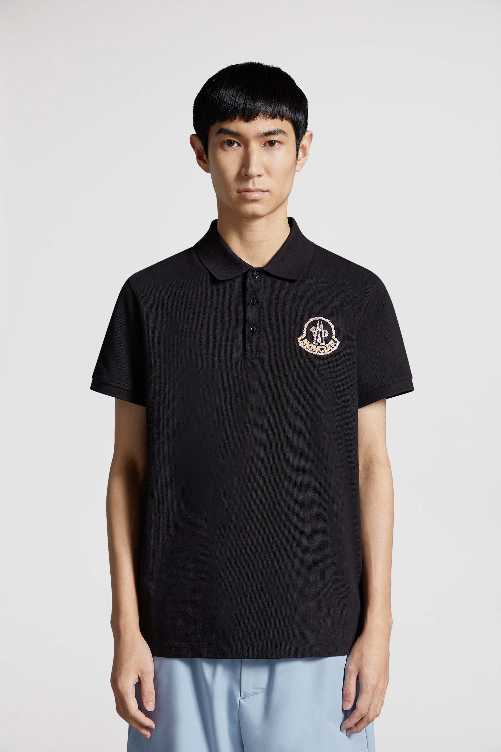 Moncler polo, black logo polo, luxury menswear, designer polo shirts, high-end fashion