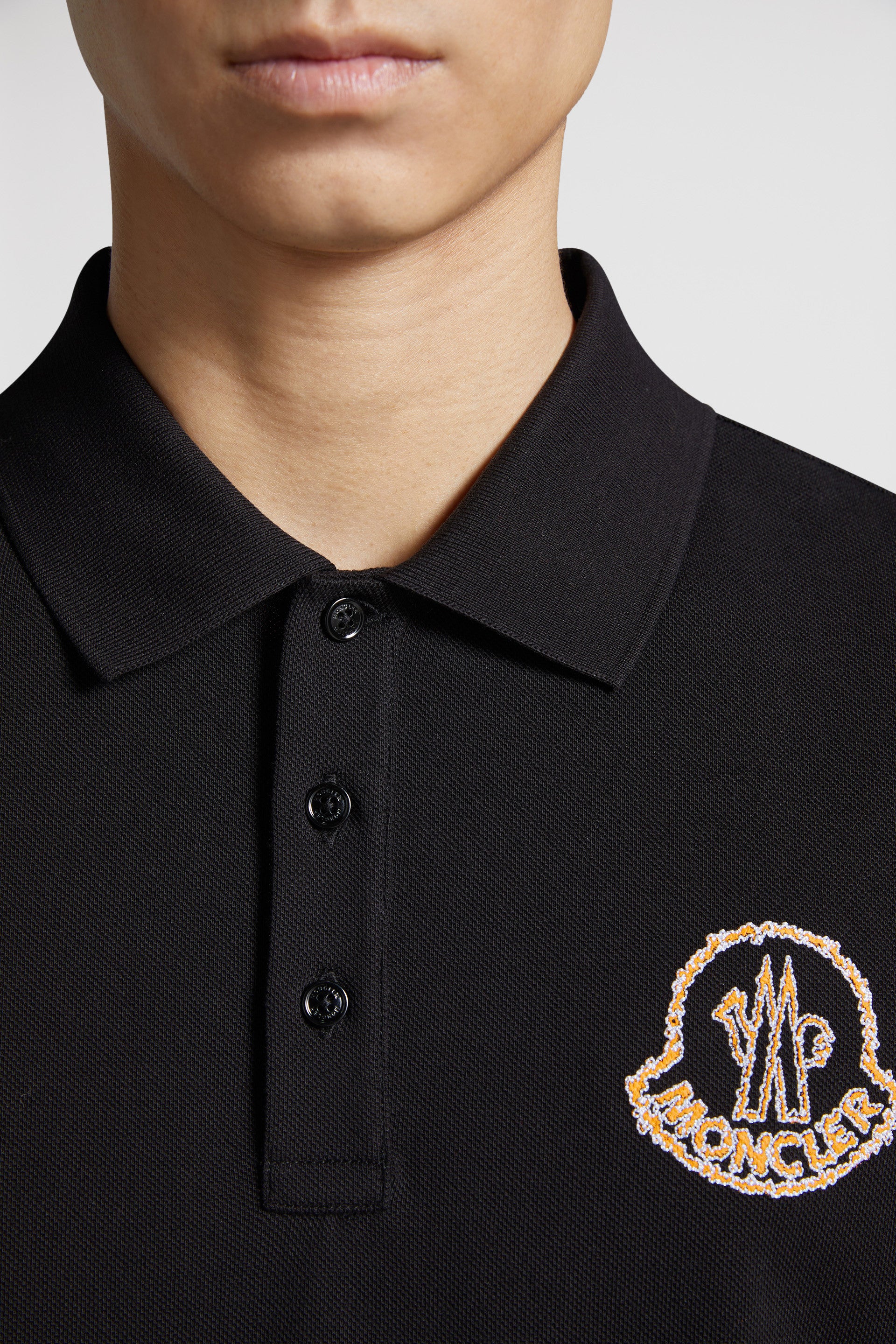 Moncler polo, black logo polo, luxury menswear, designer polo shirts, high-end fashion