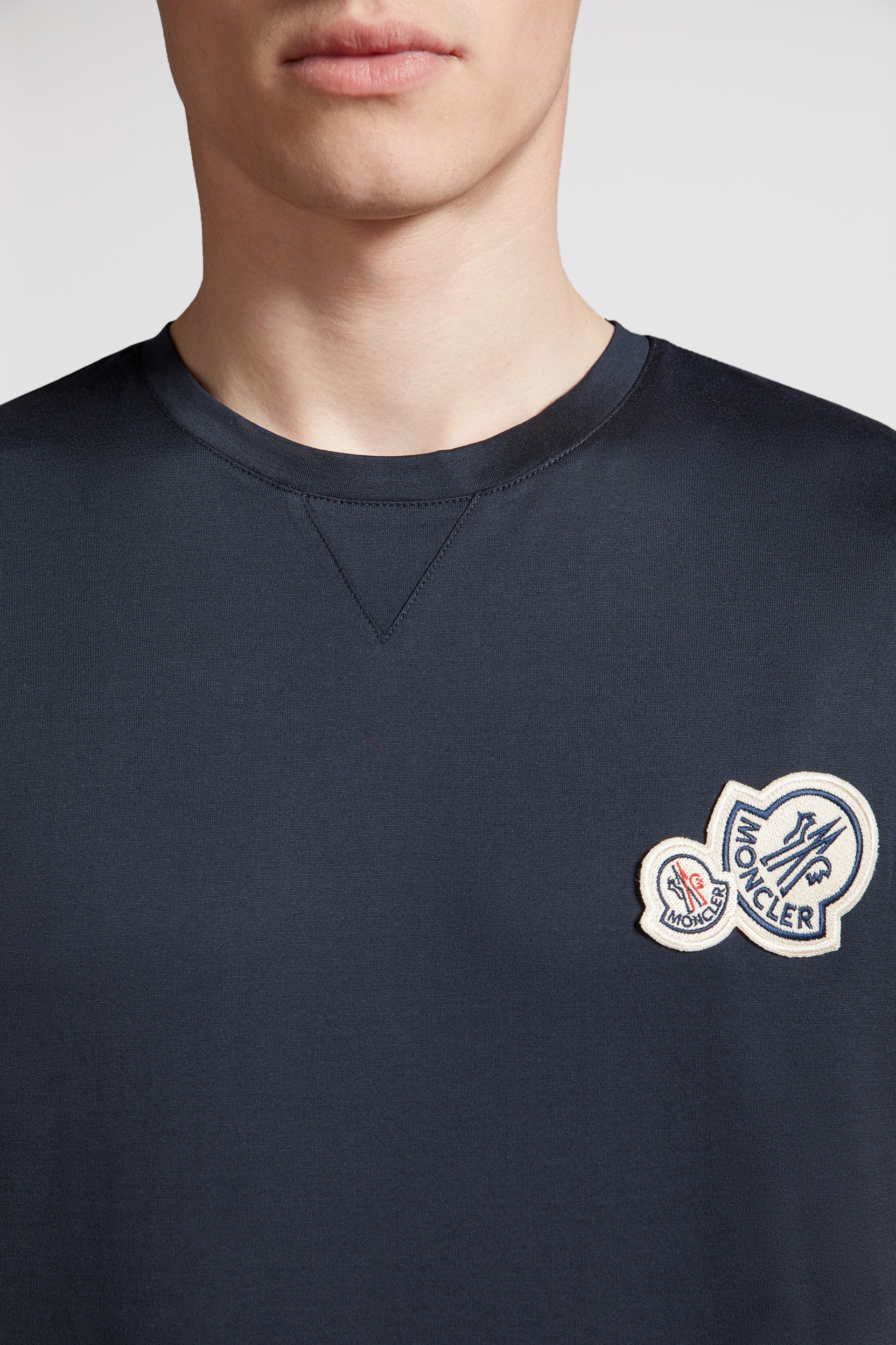 Moncler logo T-shirt,luxury blue T-shirt,designer casual wear,high-end fashion,exclusive men's apparel