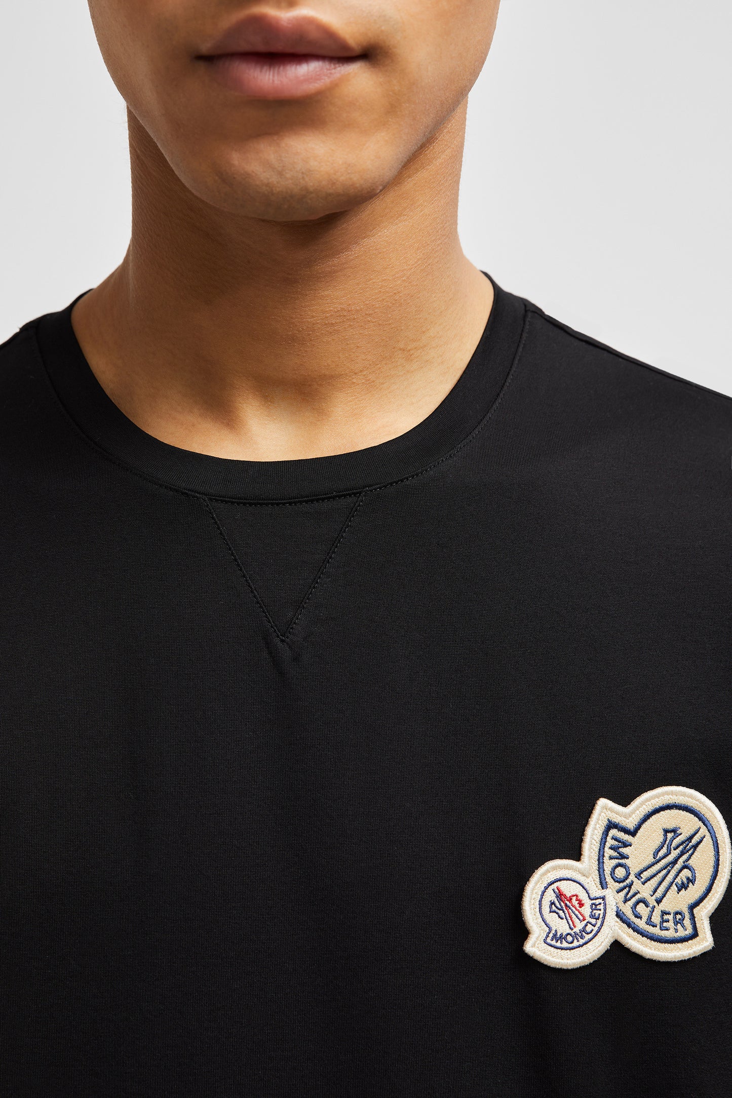 Black T-shirt, Moncler logo, luxury casual wear, designer T-shirt, premium material