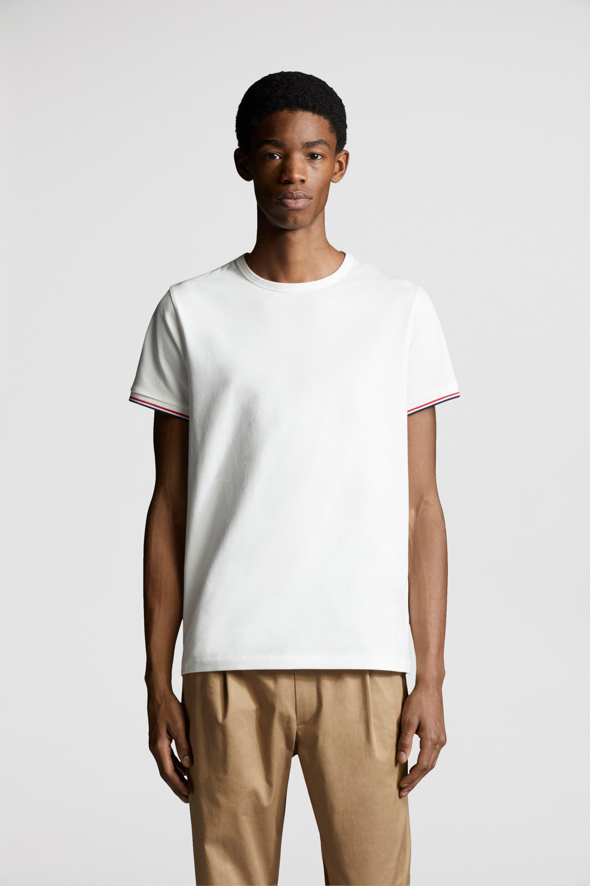 Moncler T-shirt, White logo T-shirt, Luxury trim T-shirt, High-end fashion T-shirt, Designer casual wear